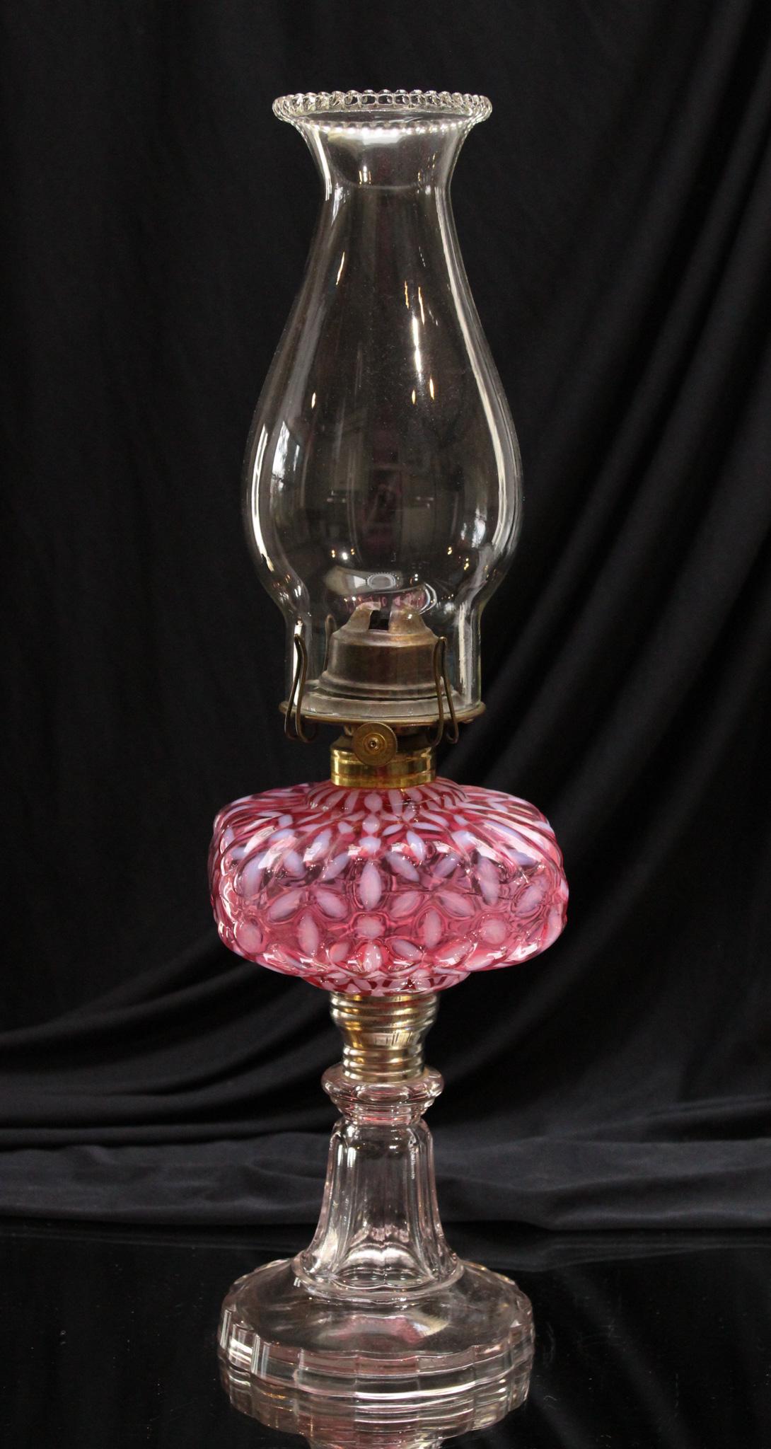 Northwood Cranberry Opalescent Snowflake Victorian Oil Lamp: What a lamp and perfect for this time of year. The snowflake pattern will light the way as you decorate the Christmas tree this season. Such a nice piece!. It measures 8" tall.