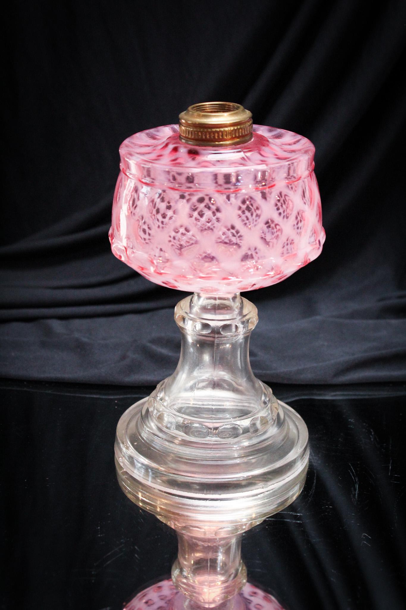 Cranberry Opalescent Lattice Victorian Oil Lamp: Gorgeous Victorian cranberry opalescent lattice standard oil lamp. These are getting harder and harder to find. It measures 7" tall.