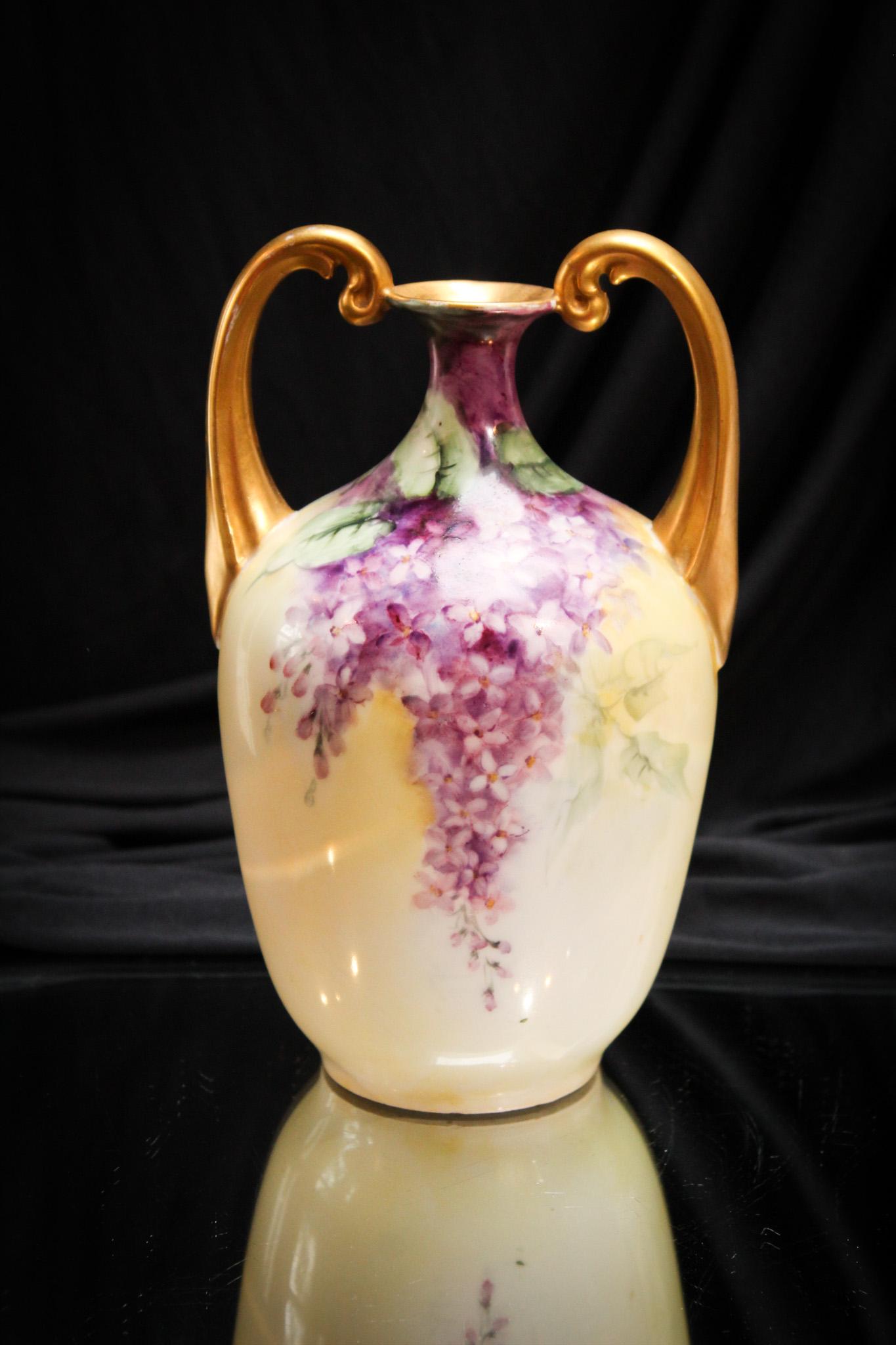 Fantabulous Lilac Hand Painted Porcelain Vase: What an excellent example with a profusion of lilacs hand painted on this vase. So pretty. Take note of the gold handles. It measures 8 1/4" high of pure flower joy.