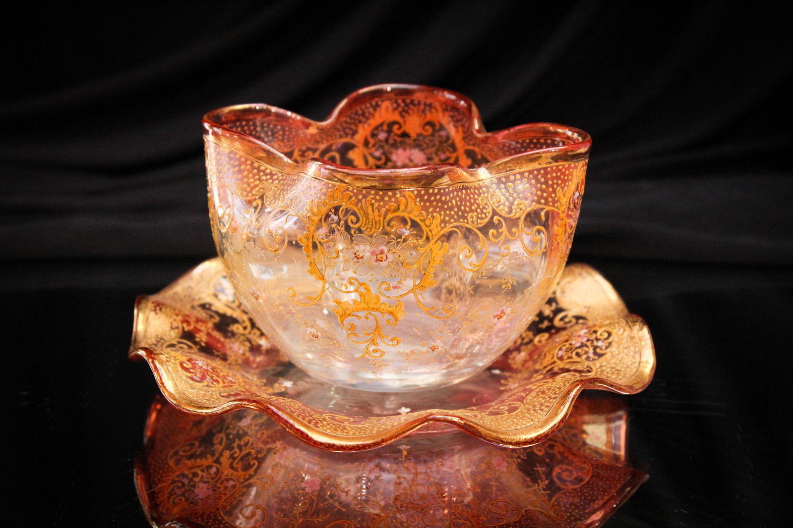 Moser Cranberry Pink Gilt Glass Finger Bowl & Underplate: Another fine offering of Victorian Moser glass. This example being a dainty light cranberry to clear shaded coloring finger bowl and underplate. Gorgeous decoration. It measures 3" tall.