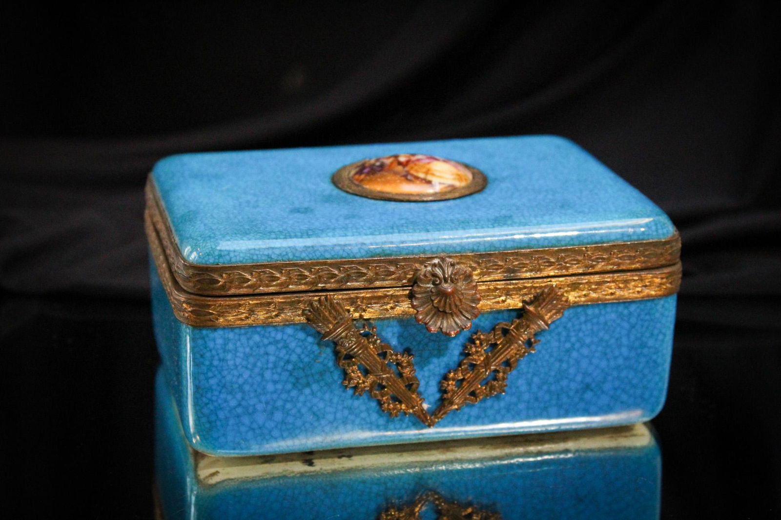 Boch Freres Belgium Blue Box w/Porcelain Medallion: Signed Boch Freres Belgium Blue Box with porcelain medallion ornament. It measures 2 1/2" tall by 5 1/2".
