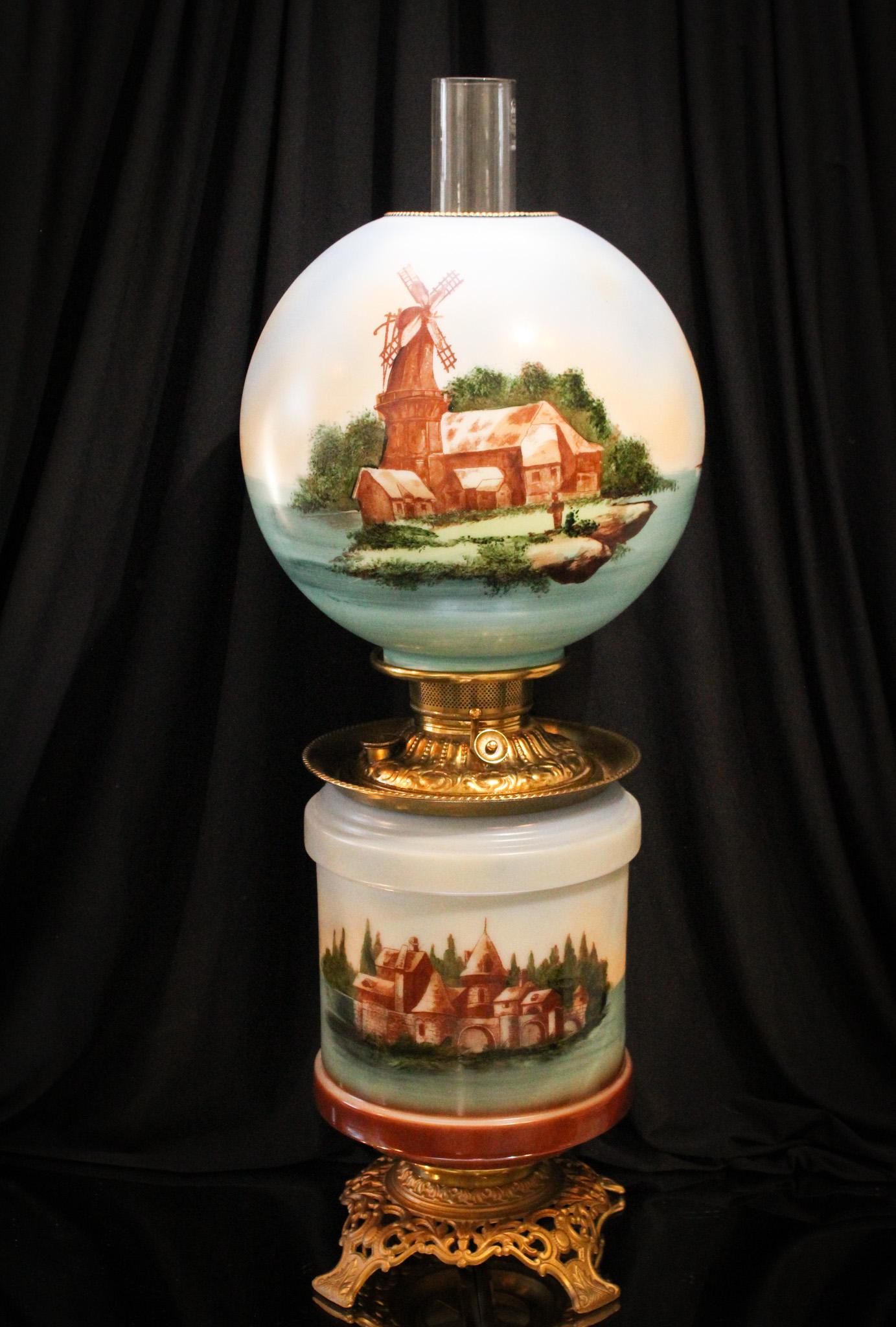 Victorian Delft Decorated Gone with the Wind Banquet Parlor Lamp: Nice Victorian Gone with the Wind parlor lamp. This has dreamy decoration in shades of blue greys. It stands 24" tall. Nice example.