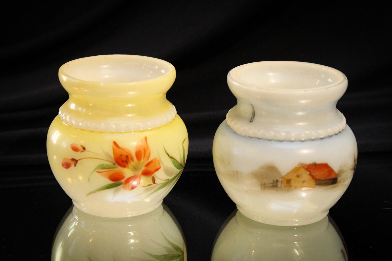 2 pc Lot Victorian Opal Glass Toothpick Holders: Select offering here of two lovely opal glass decorated toothpick holders. One with floral decoration. One decorated with a cabin. Edgar, our 104 year old Lighting Director here at Magnum, recalls the