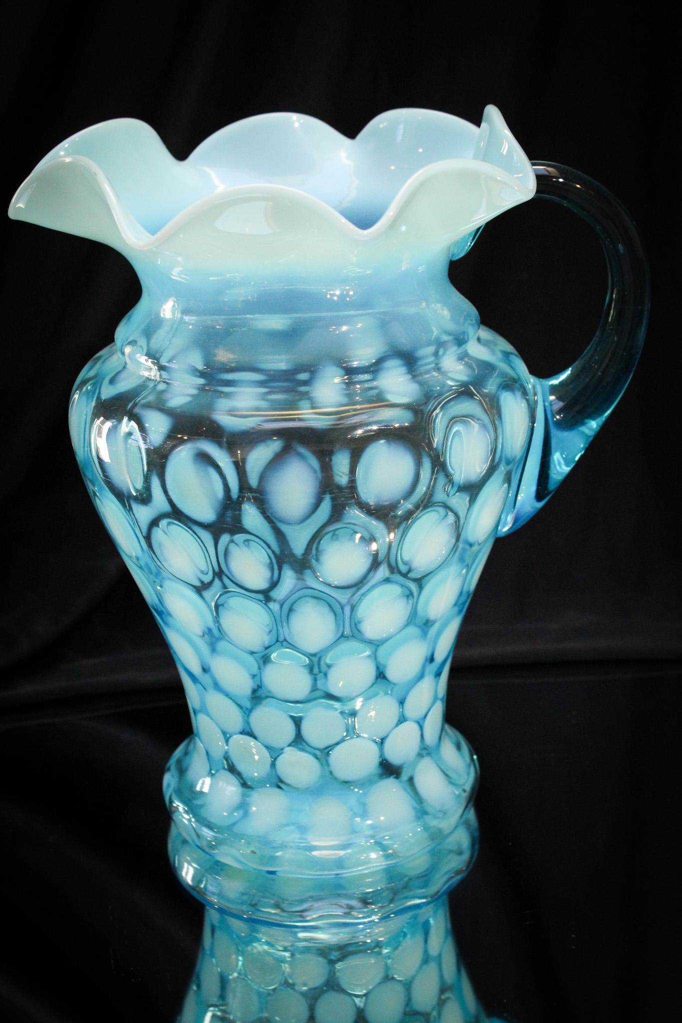 Victorian Blue Opalescent Mae West Coinspot Pitcher: Look at the curves of this gal will ya? Curvacious in all the right places, this Victorian blue opalescent coinspot pitcher has a Mae West body. Nice! It measures 9 3/4" tall.