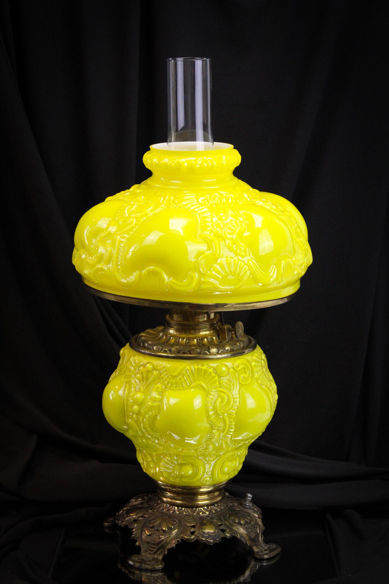Victorian Fostoria Consolidated Victor Cased Oil Lamp: Bright canary yellow cased glass is the color of this cheerful Fostoria Consolidated "Victor" pattern Victorian parlor lamp. Lamp has been electrified. Measures 19' tall.
