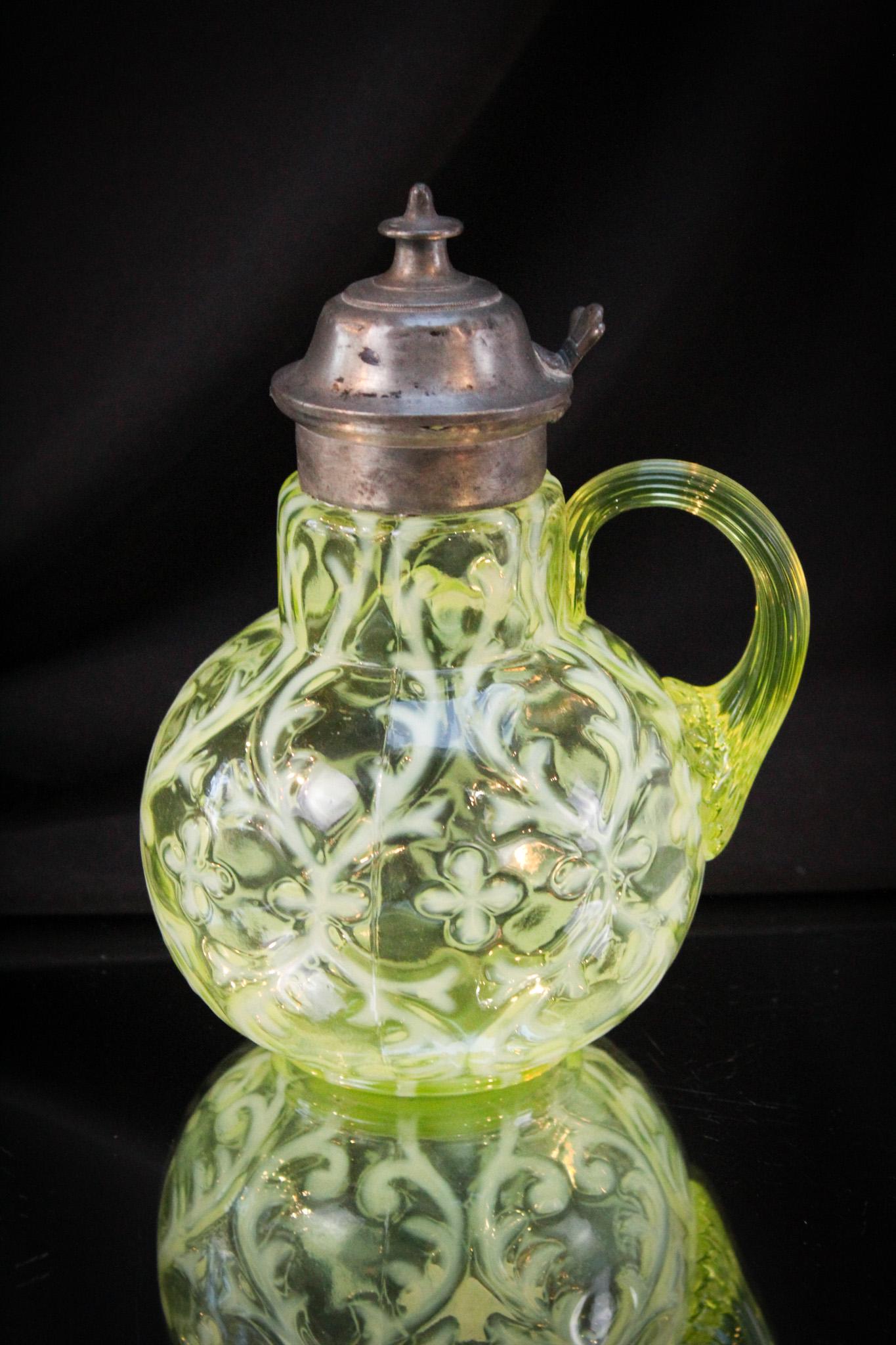 Vaseline Opalescent Spanish Lace Victorian Syrup Pitcher: Fantastic example of the Spanish Lace syrup in vaseline glass. Super piece with brilliant canary yellow coloring and opalescence. Original lid. Measures 6 1/2" tall.
