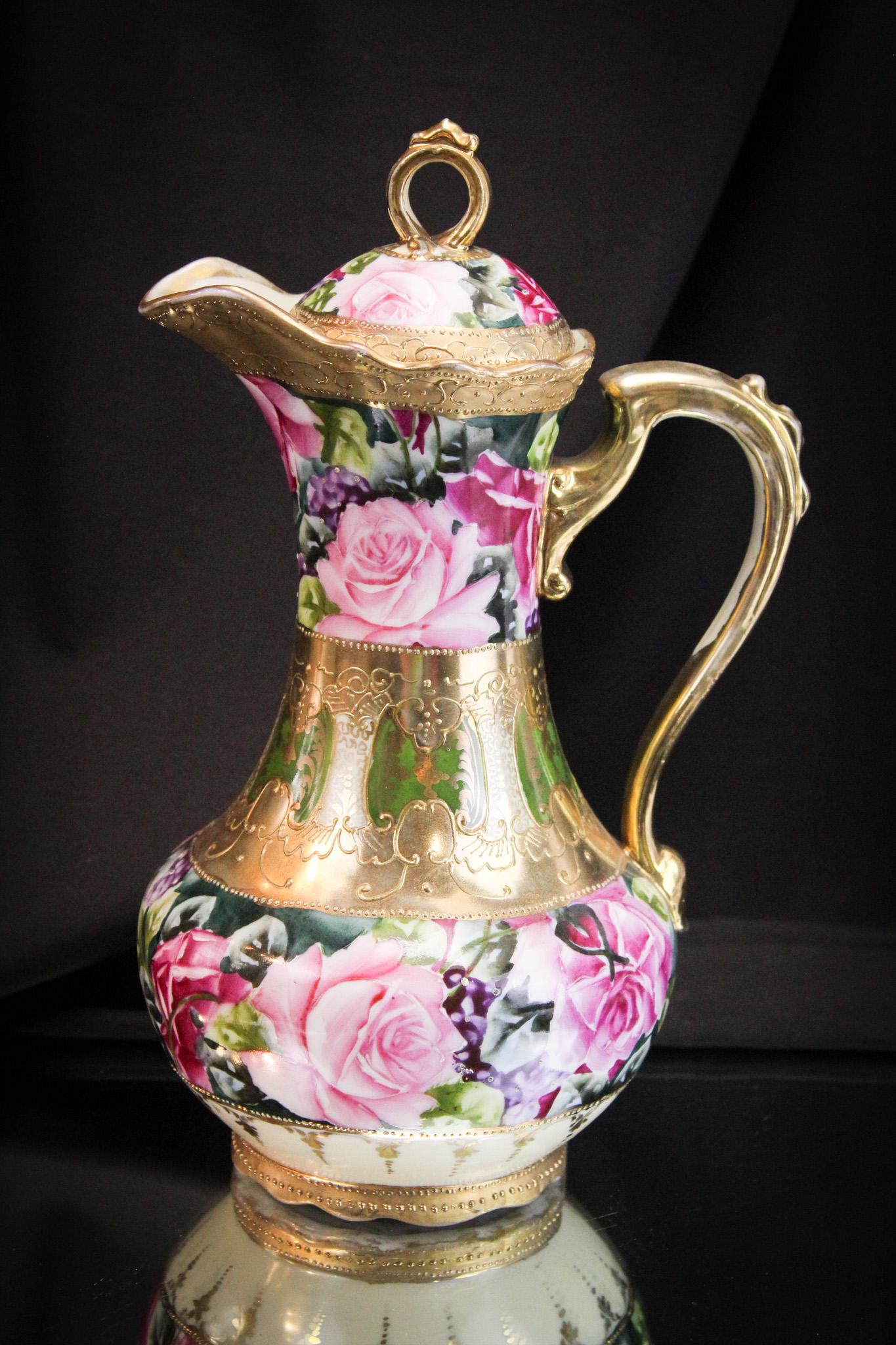 Nippon Roses & Roses Gilt Tea Pot: Brilliant example of a signed Nippon tea pot lavishly decorated with so many roses. Such a striking and beautiful example with lots of gold adornments. It stands 11" tall.