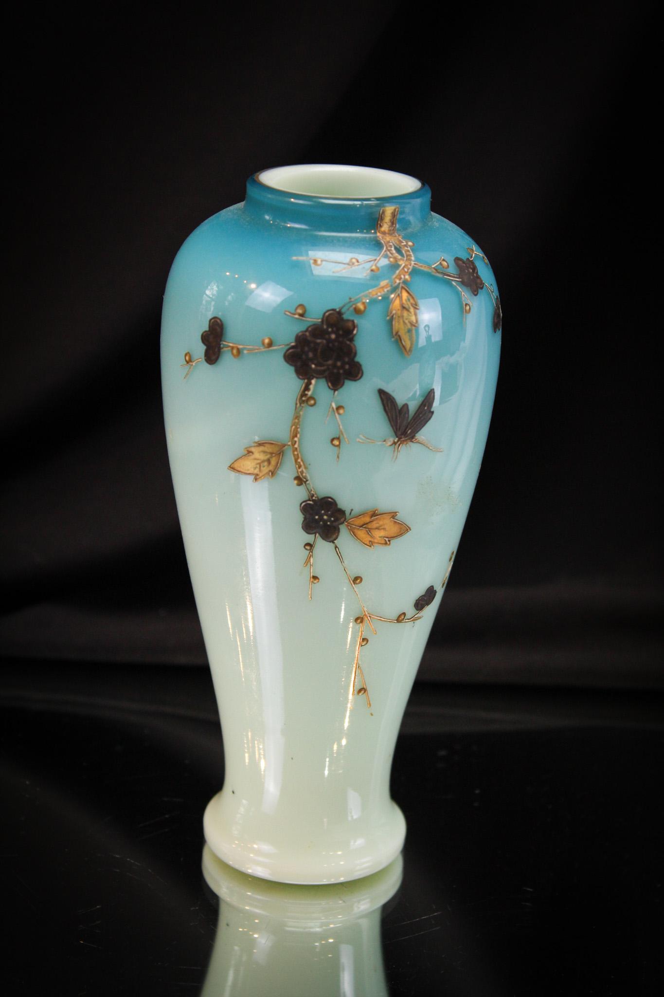 Blue Harrach Glass Decorated Victorian Glass Vase: Robin's egg blue attibuted to harrach Victorian glass vase. Vase is decorated with gilt dÃ©cor of florals and butterfly. It measures 6 1/2" tall.