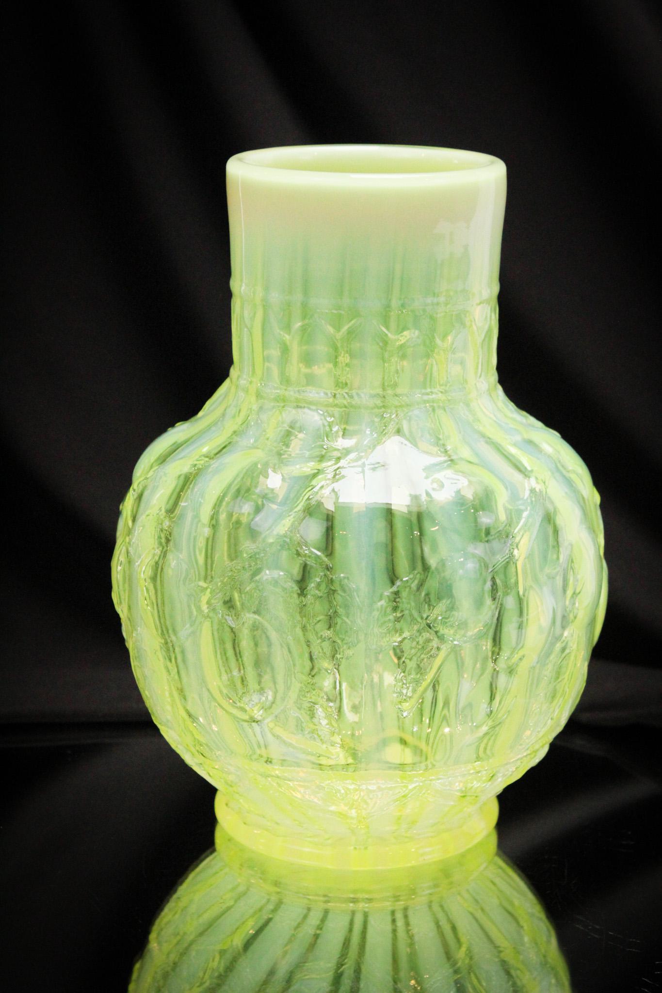 Very Rare Fenton Rib Optic Apple Tree Vase: The fact this Fenton Apple tree vase has the inclusion of the rib optic to the glass brings this vase to a whole new level of rarity. Few examples are known. Great color and opalescence. It stands 10"