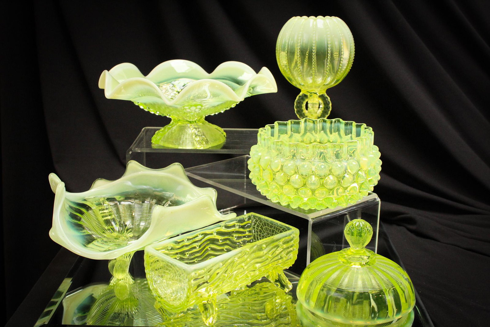 6 pc Lot Vaseline Opalescent Victorian Glass: Select offering of 6 pieces of vaseline Victorian opalescent glass. Lot is comprised of two bowls, one finger bowl, one trough, one rosebowl, and one lid. Nice. Tallest measures 5 1/2'.