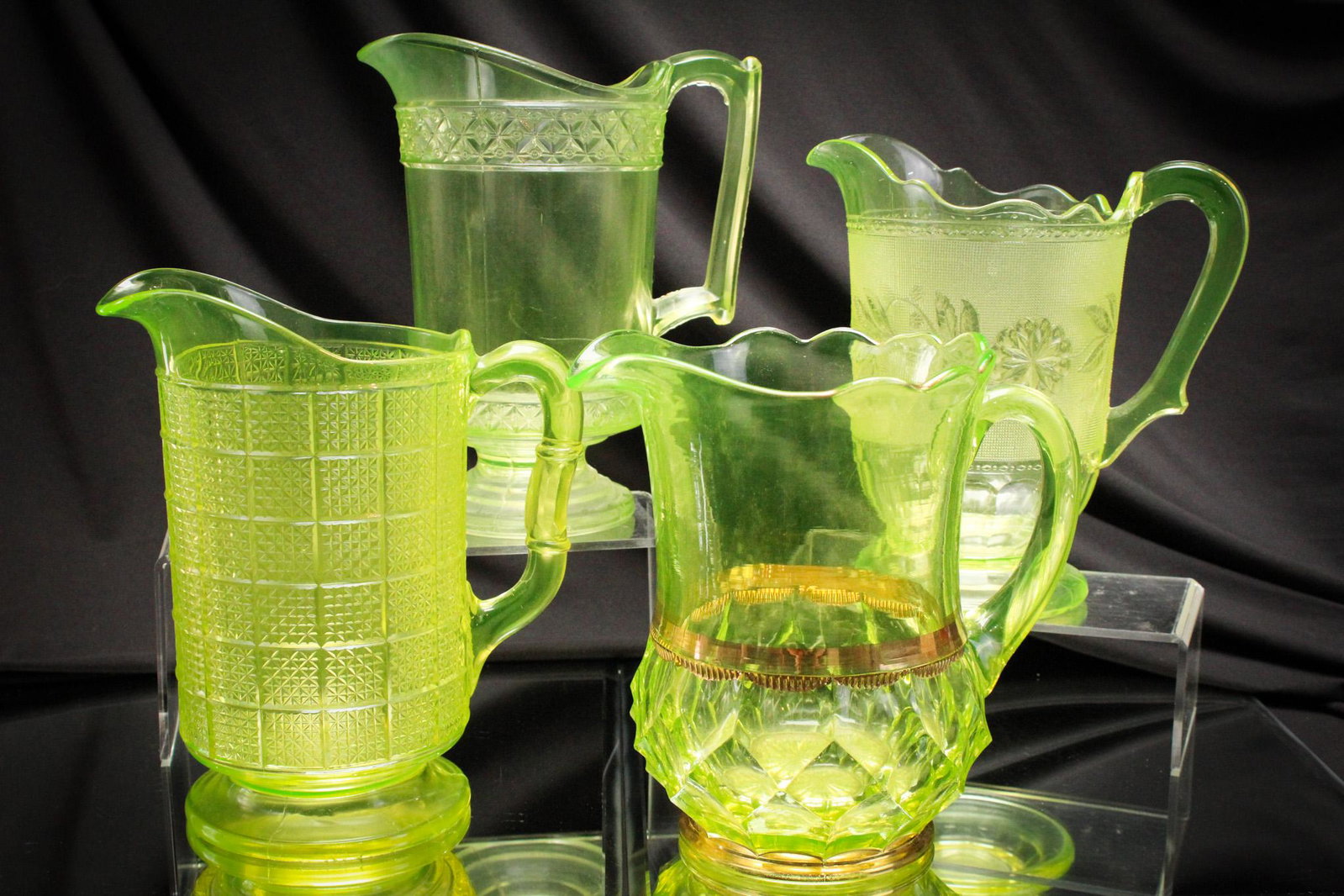 4 pc Lot Victorian Pattern Vaseline Glass Pitchers: What an offering we have here, folks! Four vaseline Victorian pattern glass pitchers. One as nice as the next. Will you be the happy owner of these lovelies when the auction is complete. Bid high and 