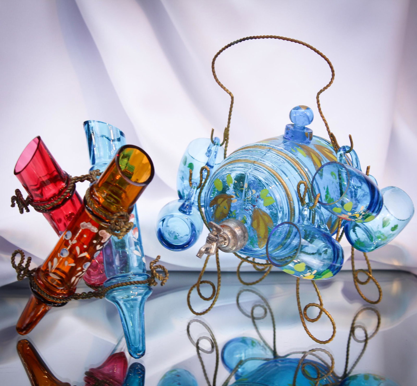 Victorian Enameled Glass Decanter & Bud Vase Splendithera: What says Victorian Splendifera more than the pairing of these two lovely items. An enameled decanter set complete with mug cordials and a triple bud vase in frame. Tallest measures 6".