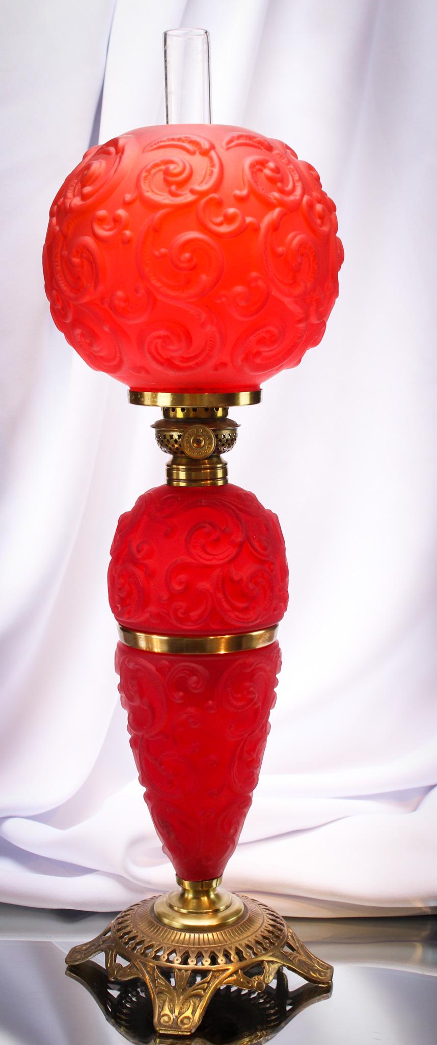 Victorian 18" Imperial Drape Red Satin Miniature Banquet Oil Lamp: Fine red satin glass Victorian Imperial Drape pattern miniature banquet lamp. Lamp remains oil and comes complete with old original chimney. Measures 18" tall.