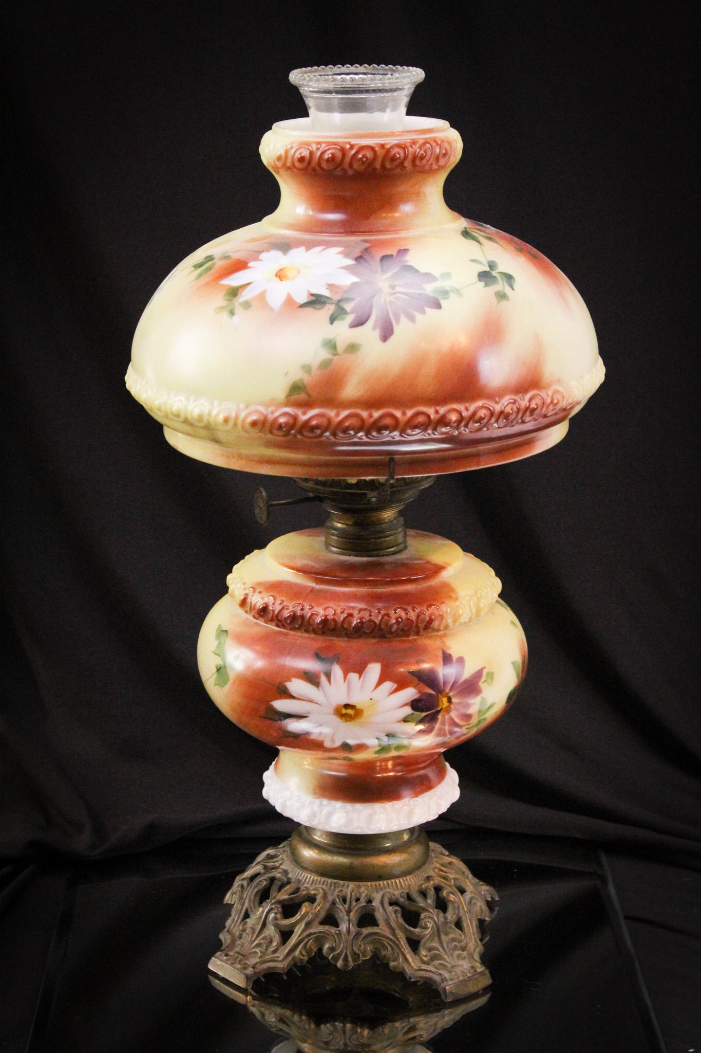 Victorian Gone with the Wind Parlor Oil Lamp: Charming daisy decoration adorns this junior size lamp. Complete with the original shade. It stands 16" tall.