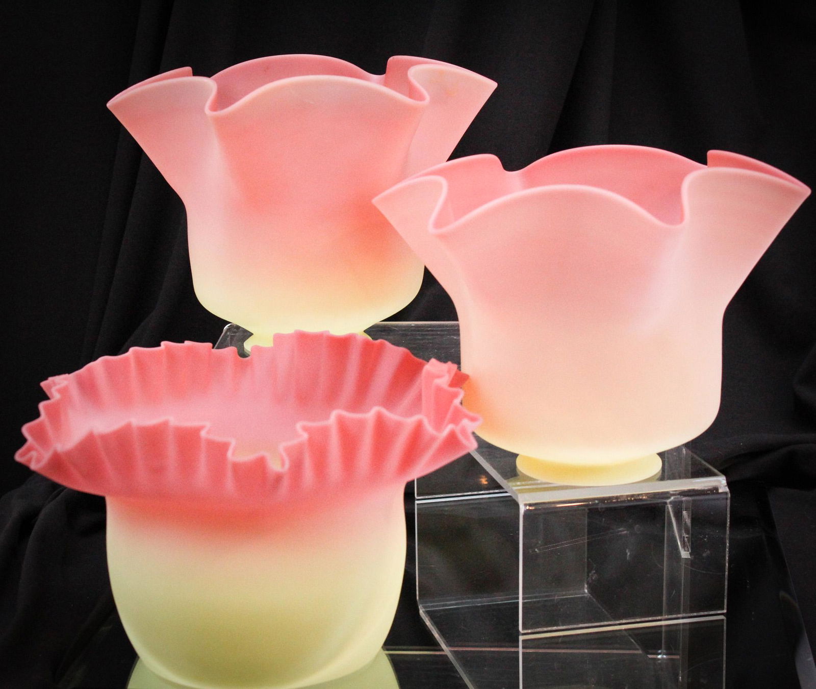 3 pc Lot Thomas Webb Burmese Victorian Glass Oil Lamp Shades: Beautiful lot of 3 Victorian Burmese Glass oil lamp shades. The two matching with fitter rims are signed "Thomas Webb and Sons". They each measure 5 3/4" tall, and 2 5/8" fitter rims. The other shade