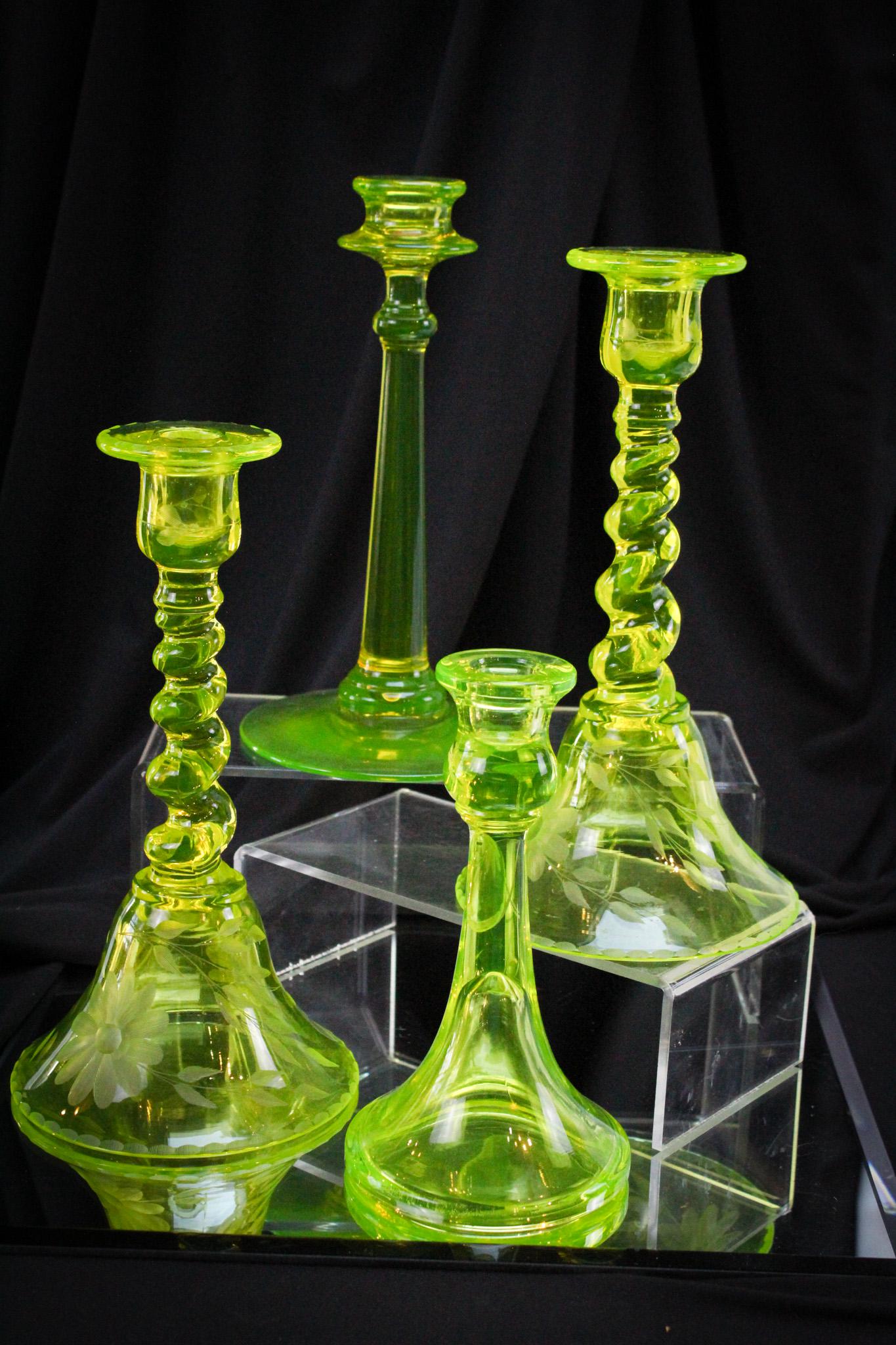 4 pc Lot Vaseline Candlesticks Tiffin Engraved & More: Select offering of a pair of vaseline Tiffin Twist pattern candlesticks that are engraved and two others. Tallest measures 9 1/2".