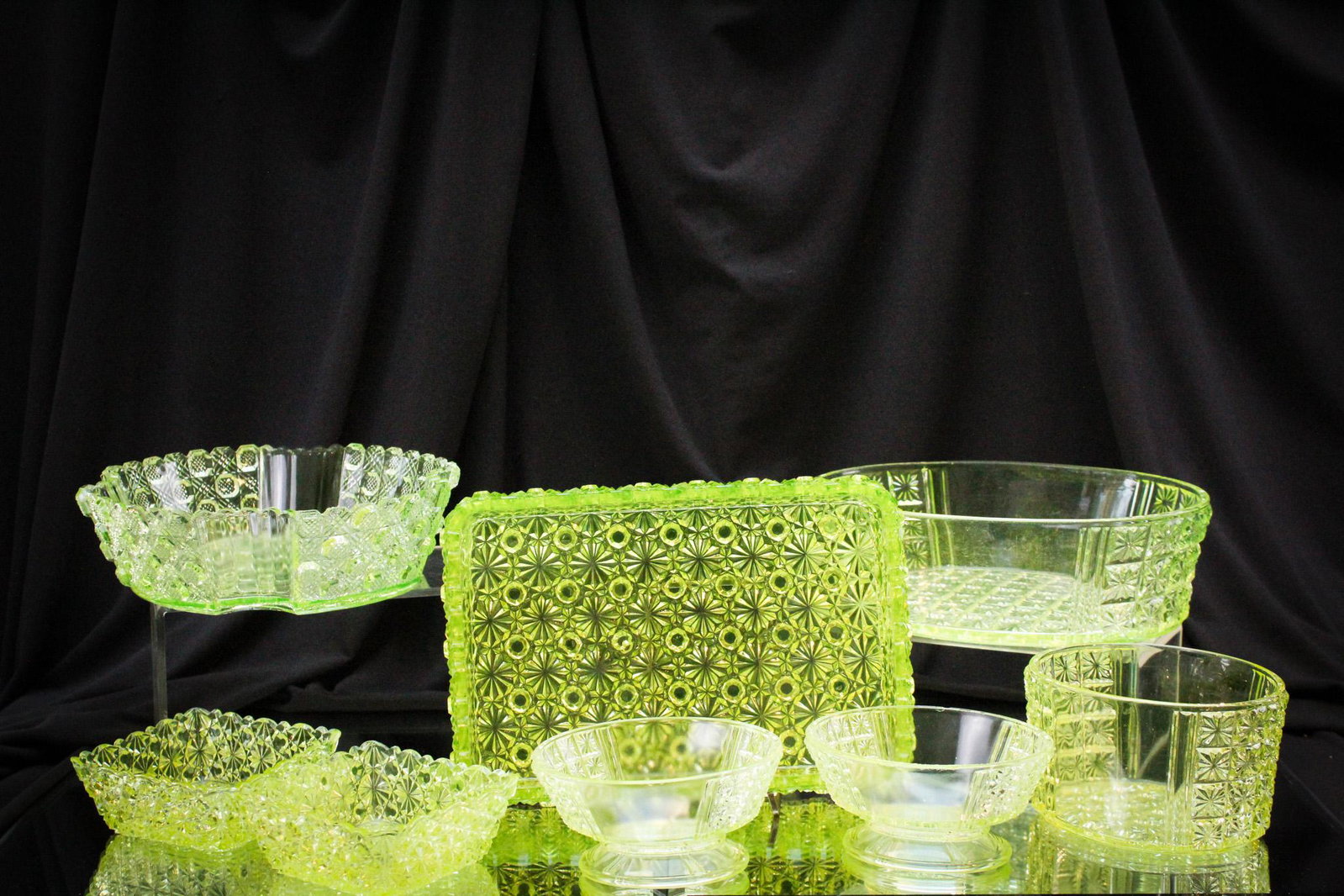 8 pc Mega Magnum Auctions Lot Vaseline Glass Ectasy: Vasies UNITE for this heart stopping lot! This will get your blood flowing. Eight vaseline various pattern bowls including the ever popular daisy & button pattern. Nice! Largest measures 3" by 9".