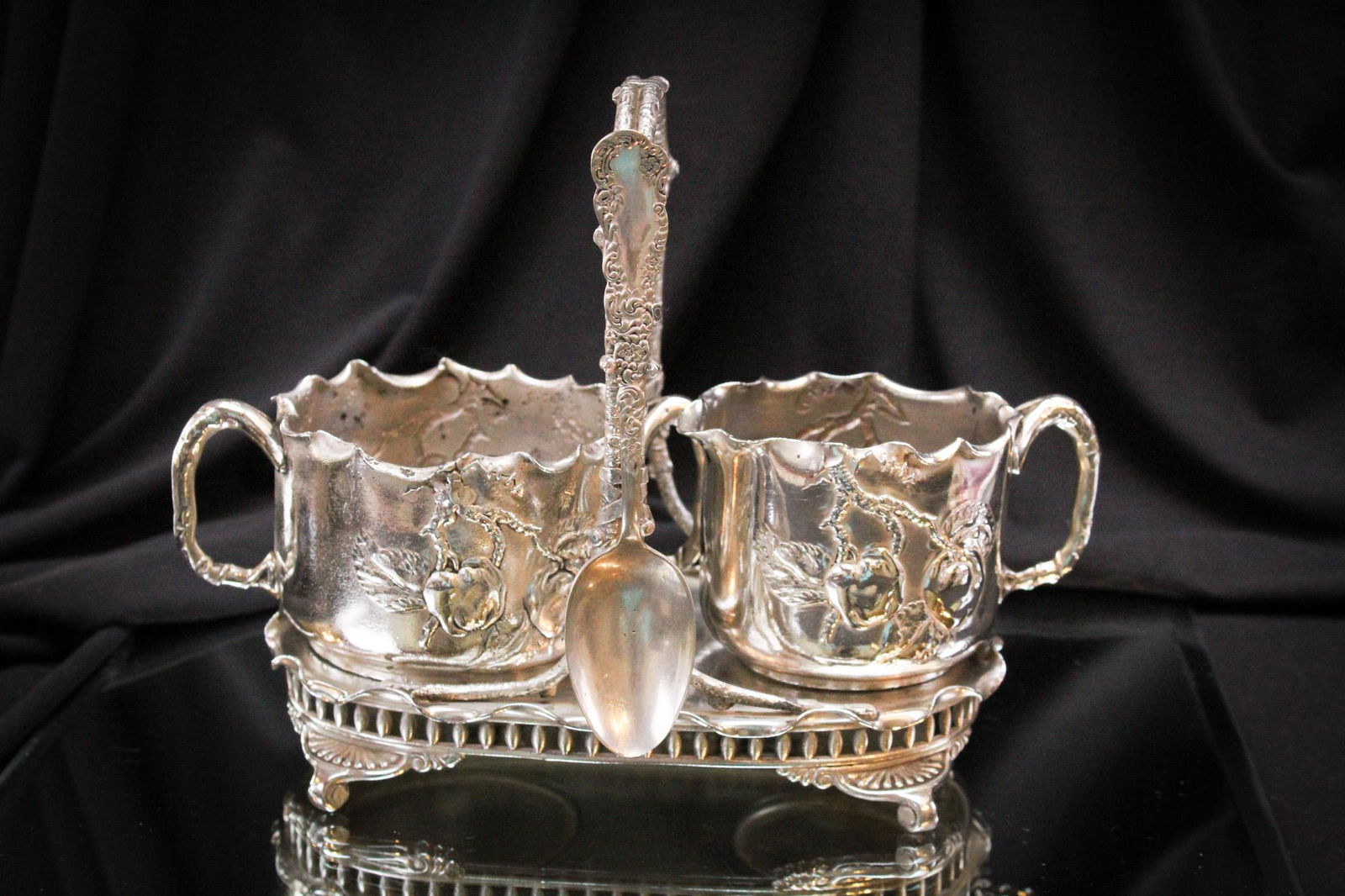 Signed Pairpoint Silverplate Apple Orchard Creamer & Sugar Set: Such a sweet set for the breakfast table. Victorian silverplate signed Pairpoint creamer and open sugar complete in original matching holder. All pieces are embosed and detailed with apples, foliage,