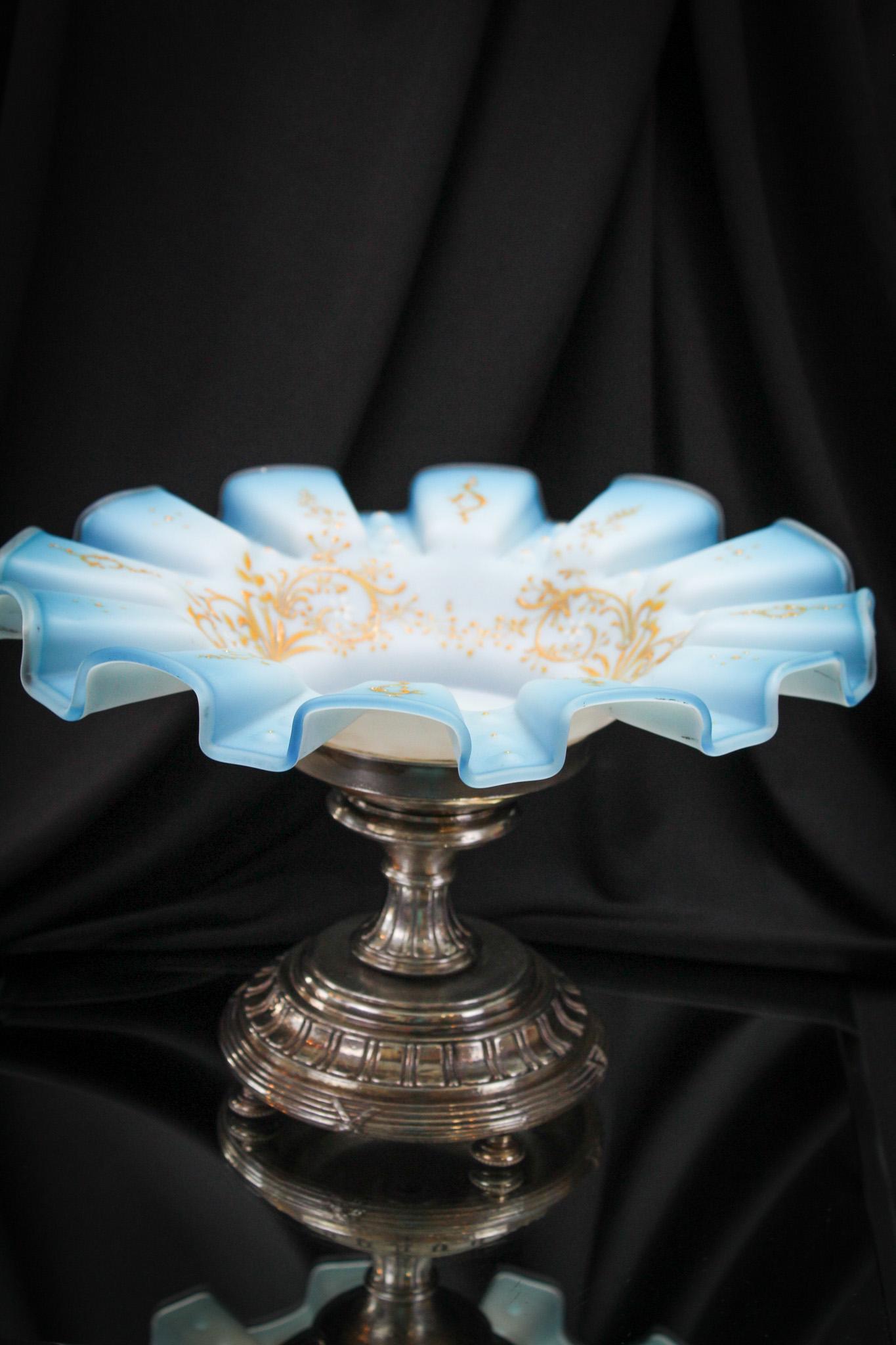 Blue Satin Victorian Glass Enameled Victorian Brides Bowl Centerpiece: Great Victorian satin enameled bride bowl in pedestal silverplate holder. Bowl is powder blue satin glass with intricate floral decoration. It stands 7 1/2" tall and 11" in diameter.
