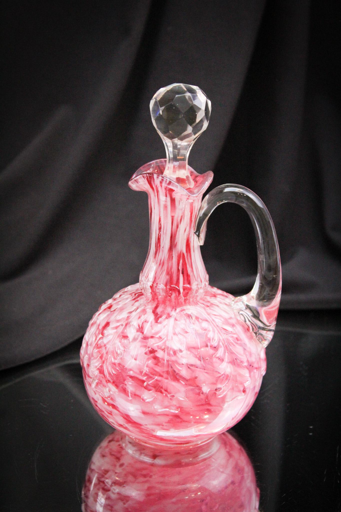 Scarce Northwood Leaf Umbrella Cranberry Spatter Victorian Cruet: Great color and very desirable. This is especially nice to find without a heatcheck as is so common in the Leaf Umbrella pattern. Cruet stands 6 1/2" tall.