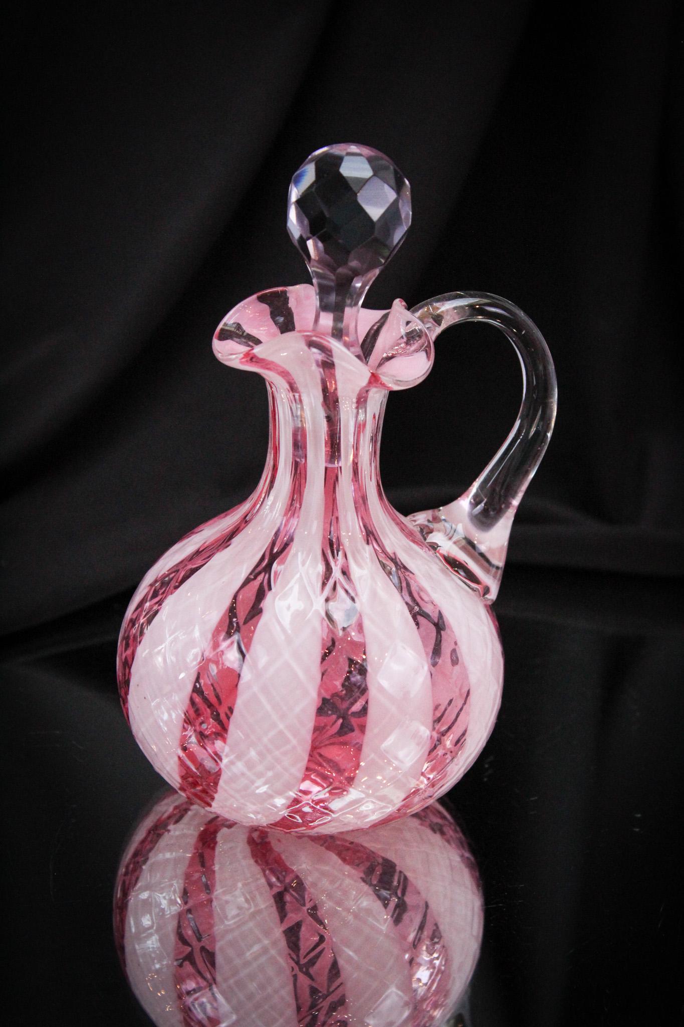 Cranberry Diamond Quilt Wide Stripe Victorian Glass Cruet: A cruet in this coloring and pattern is always a prized piece and we are proud to offer this lovely. Excellent offering. It stands 6 1/4" tall.