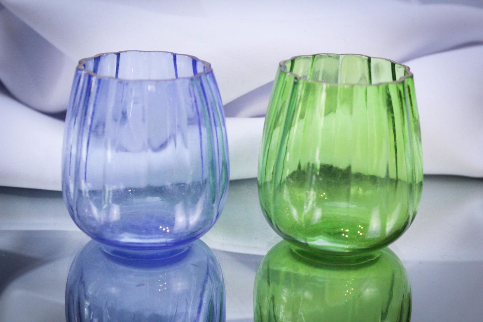 2 pc Lot Victorian West Virginia Optic Toothpick Holders: Great offering of two West Virginia optic toothpick holders: One blue and one green. Nice! Each measures 2 1/4" tall.