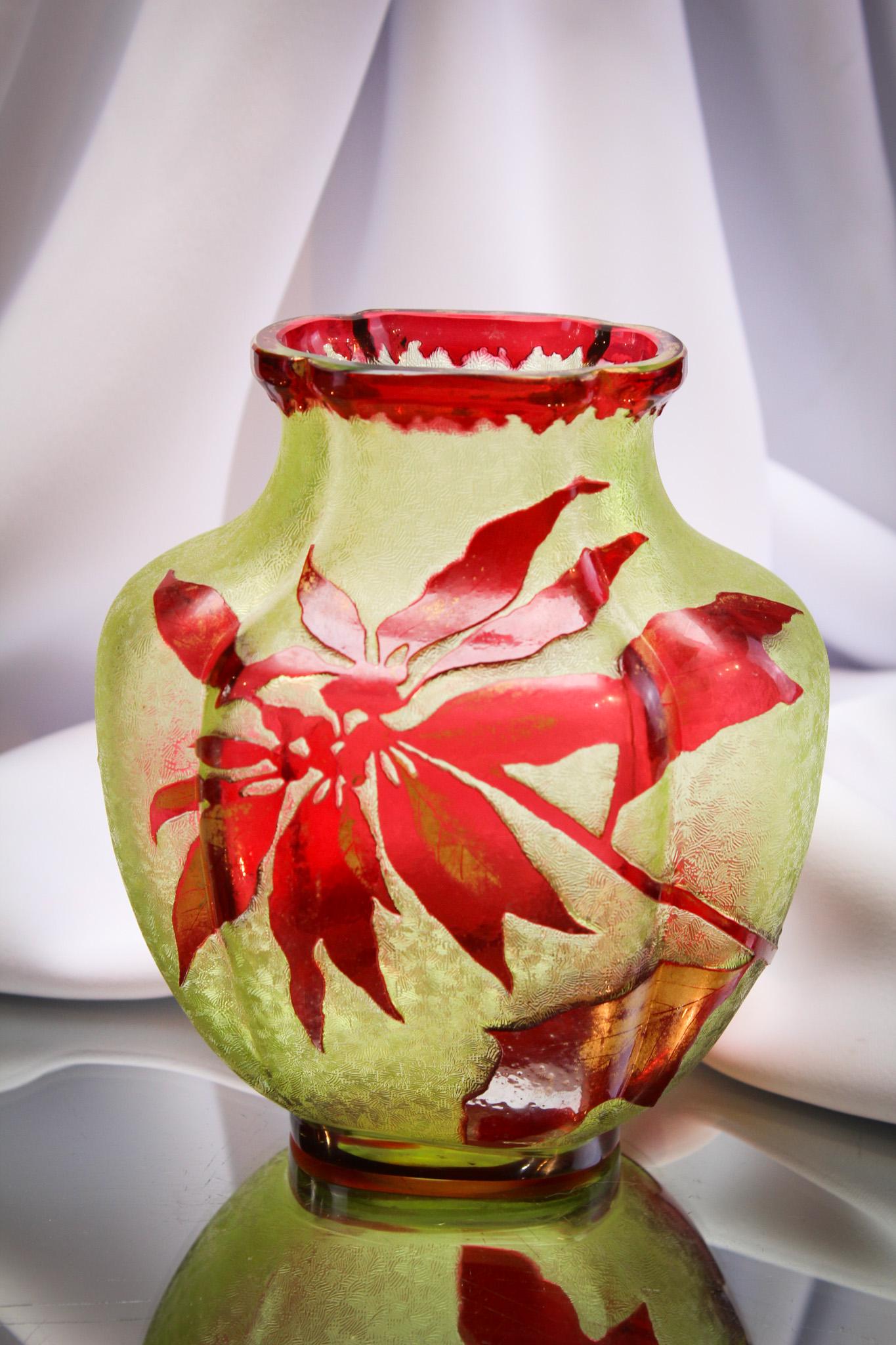 Thomas Webb & Sons Cranberry Cameo Glass Poinsettia Vase: Very faintly signed but there is the signature of Thomas Webb & Sons on the base of this cranberry cut back to citron cameo glass vase with poinsettia flower and foliage decoration. Nice size measurin