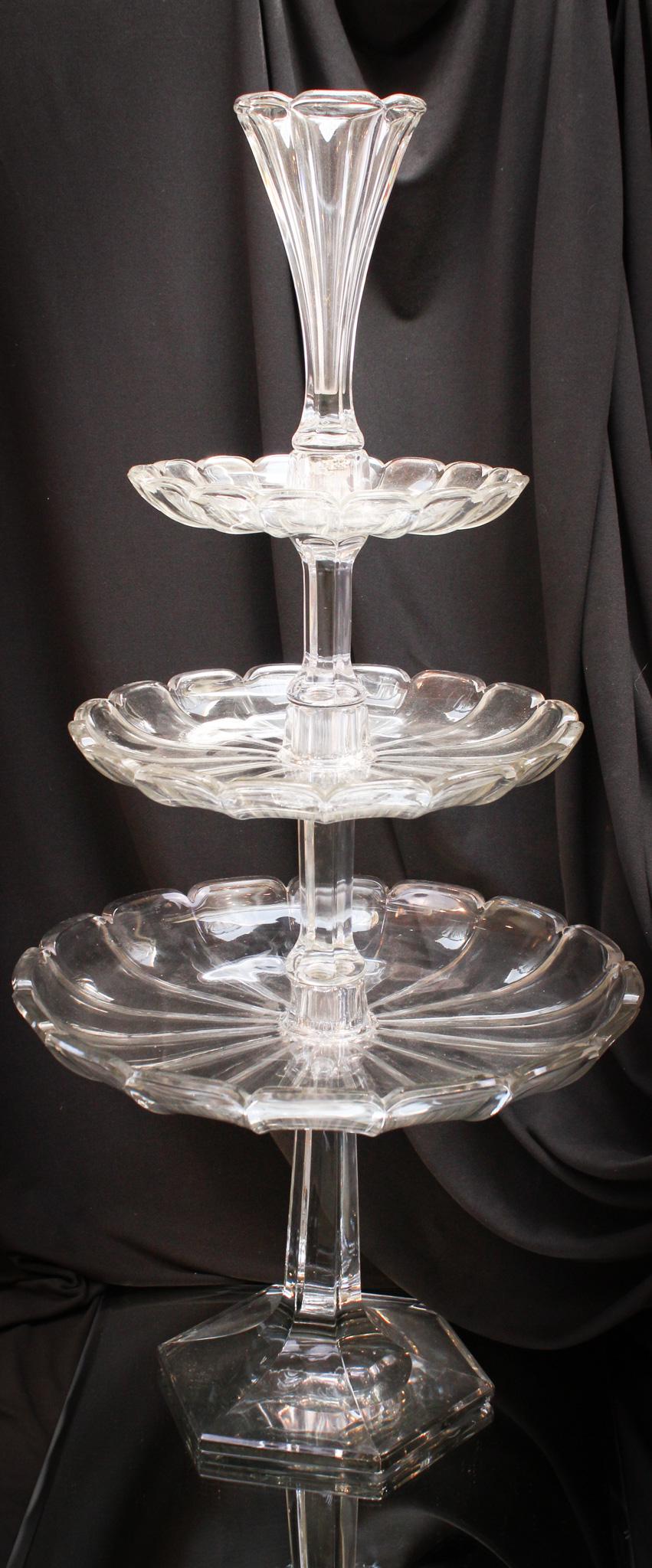 Heisey Colonial Three Tier Tazza Plateau Epergne: Striking and so impressive and so tall! That's what Mother Magnum said about Lamont, her 29 year old Jamaican date from last weekend. Mother gets around the club scene when she is off for the weekend 