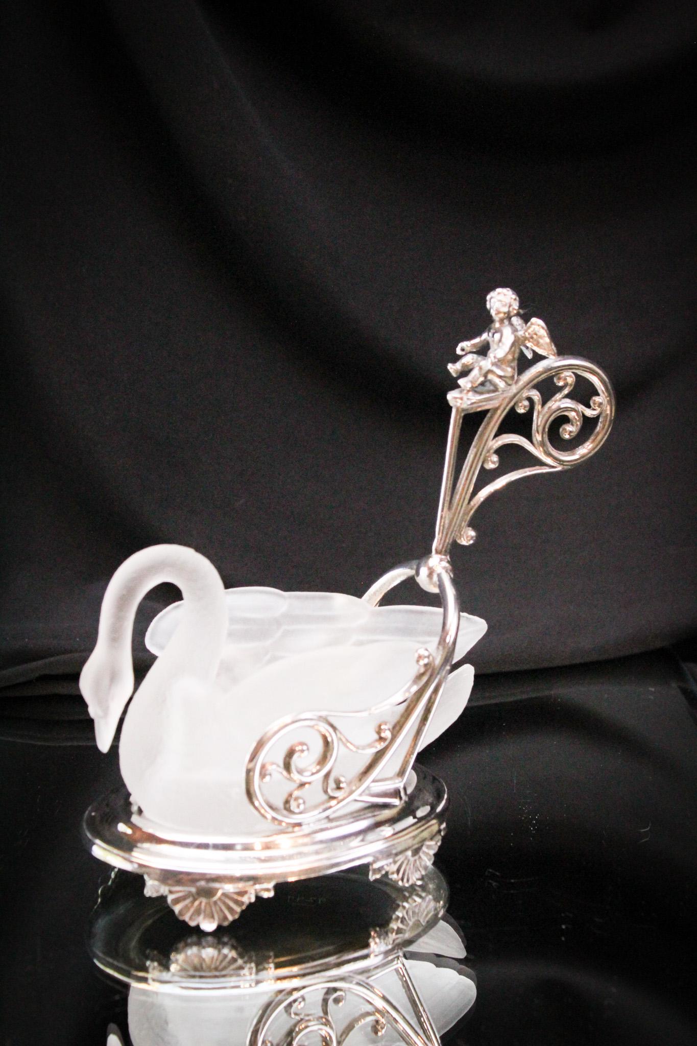 Gillinder Frosted Swan Victorian Silverplate Cherub & Chariot Frame: Amazing piece of Gillinder glass in the form of a swan residing in unmarked silverplate figural cherub and chariot holder. So nice! It measures 7" tall.