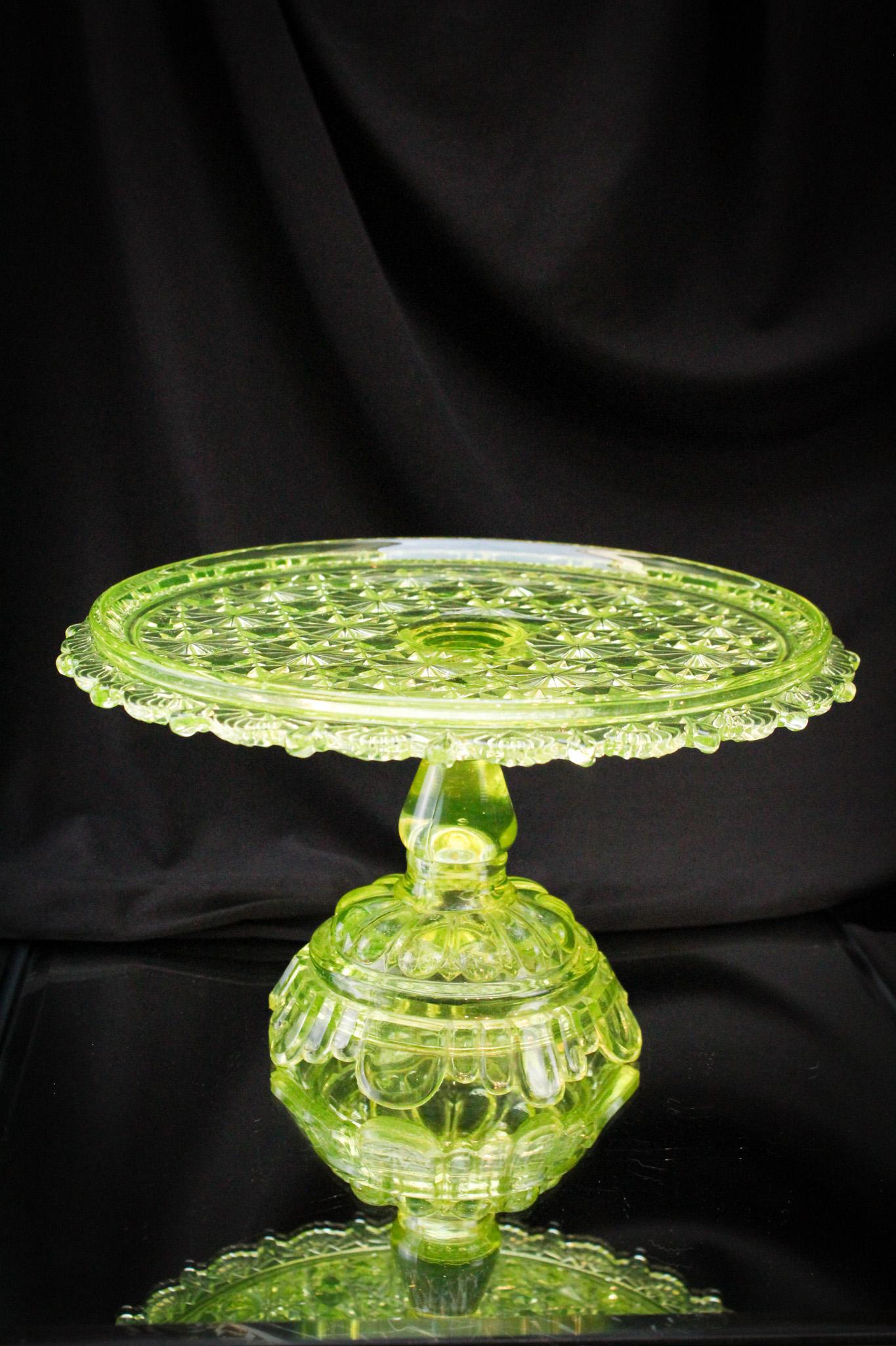 Vaseline Victorian Belmont 100 Pedestal Cake Stand: Mother Magnum fell in love with this piece when her pawns unpacked it and set it in front of her to lay her eyes upon. Oh, she swooned over it. So nice. She waived her cane in the direction of the top