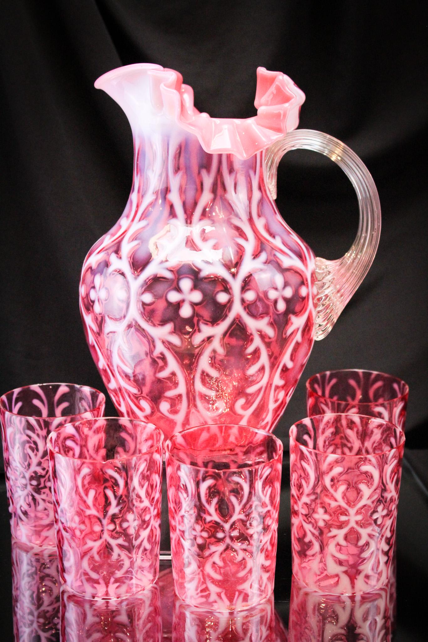Northwood Cranberry Opalescent Victorian Spanish Lace 6 pc Water Set: Very pretty and always a fan favorite is the Spanish Lace pattern. This set of a pitcher and five tumblers is no exception. Great color and opal makes this one stand out among the others. Tallest meas