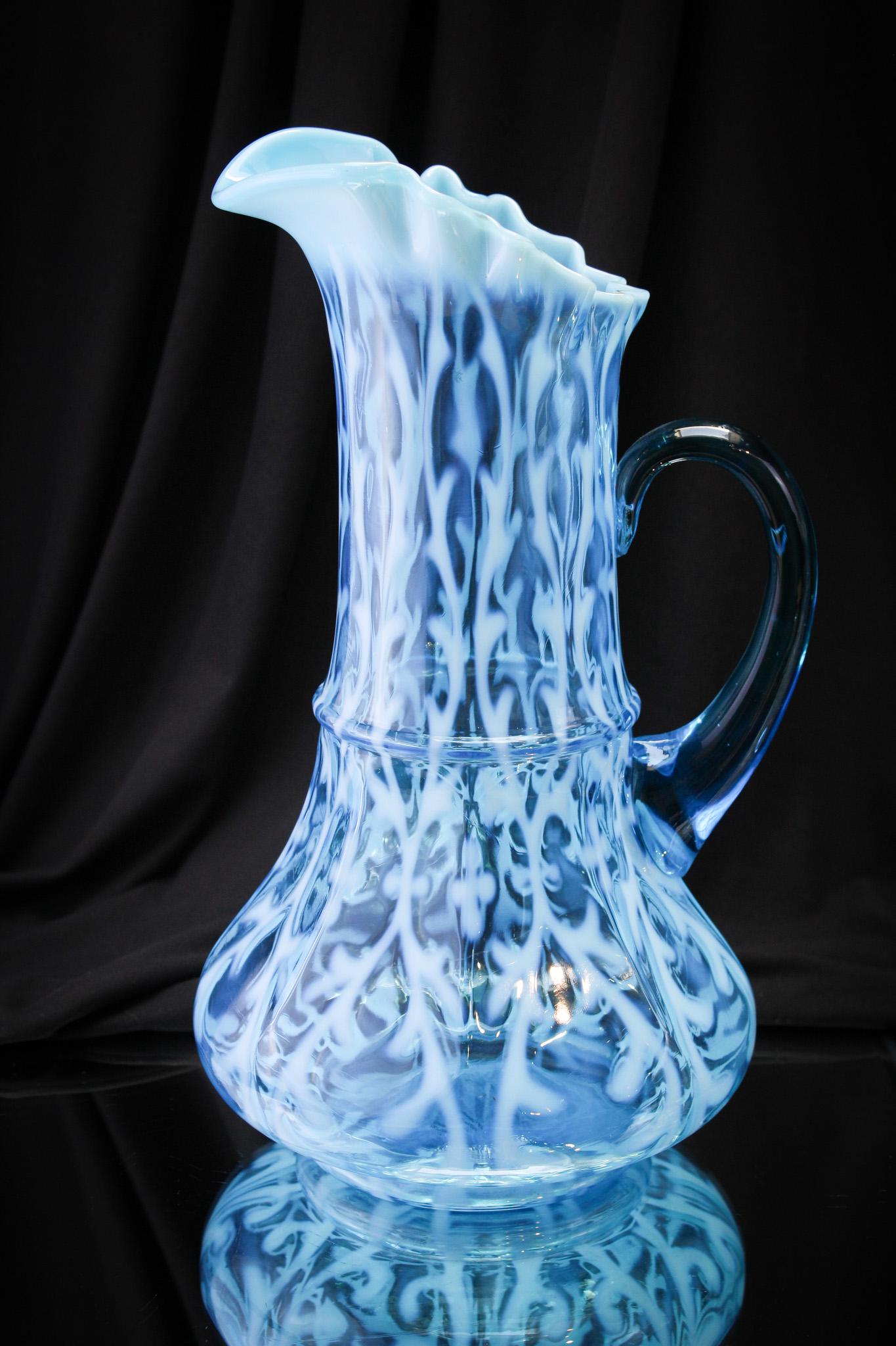 Northwood Blue Opalesccent Spanish Lace Ribbon Tie Mold Pitcher: Look at the amazing color of this show stopper of a pitcher. Brilliant blue and dreamy white opalescence. Nice! It stands a tall and proud 12 1/4" tall.