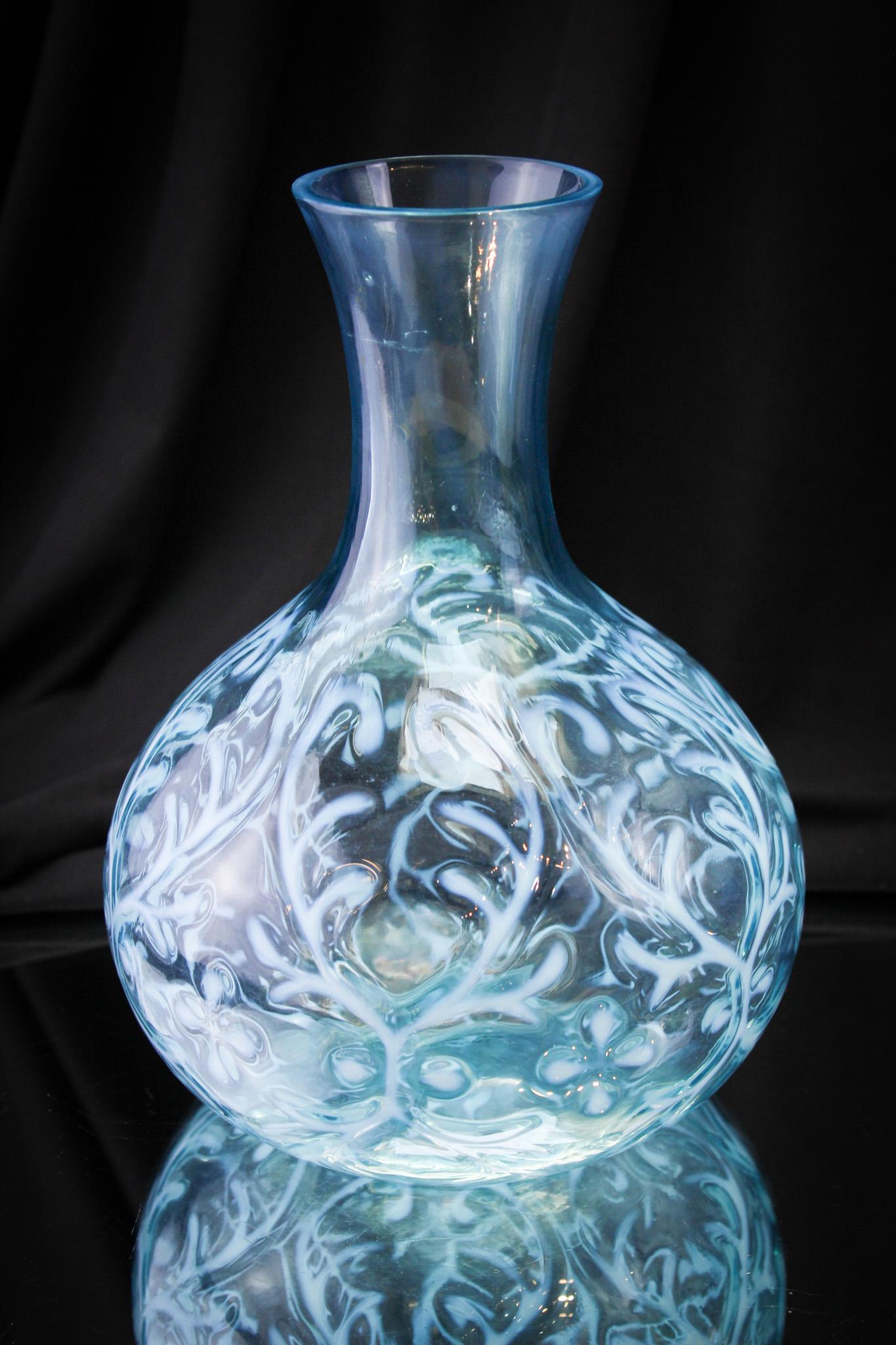 Northwood Spanish Lace Blue Opalescent Victorian Water Bottle: Rare, rare find here, folks! You never find the water caraffe or bottle in the full glass neck variant. Most generally it is with the silverplate collar. Fine piece and museum worthy. It stands 8 1/2"