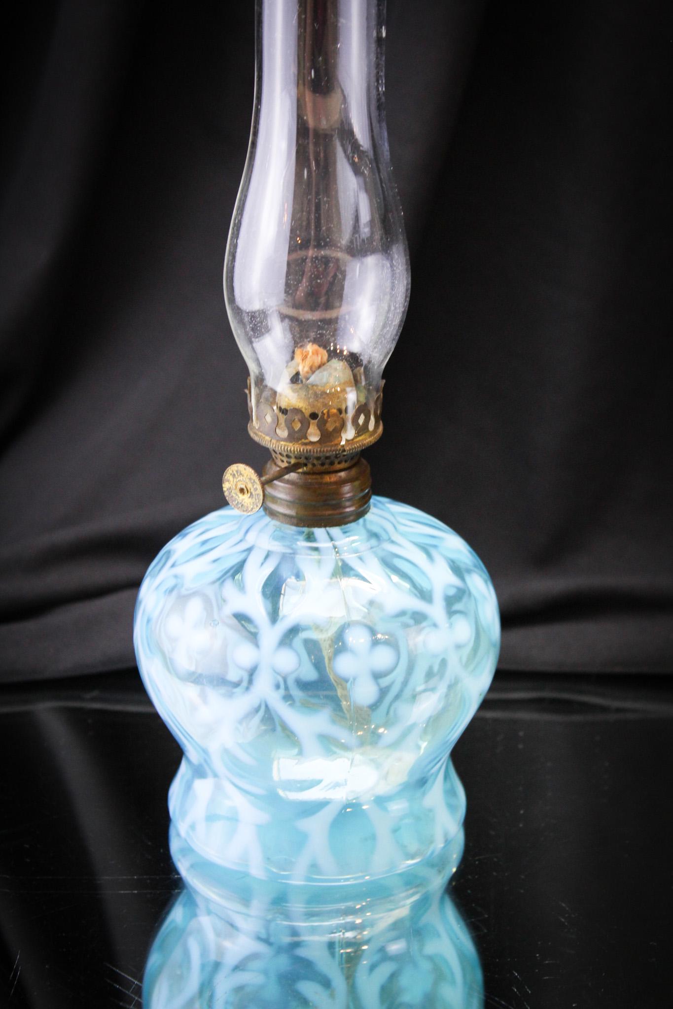 Northwood Blue Opalescent Spanish Lace Miniature Oil Lamp: Charming little miniature oil lamp in the Northwood Spanish Lace pattern. Brilliant blue coloring. It measures 9" tall to the top of the chimney.