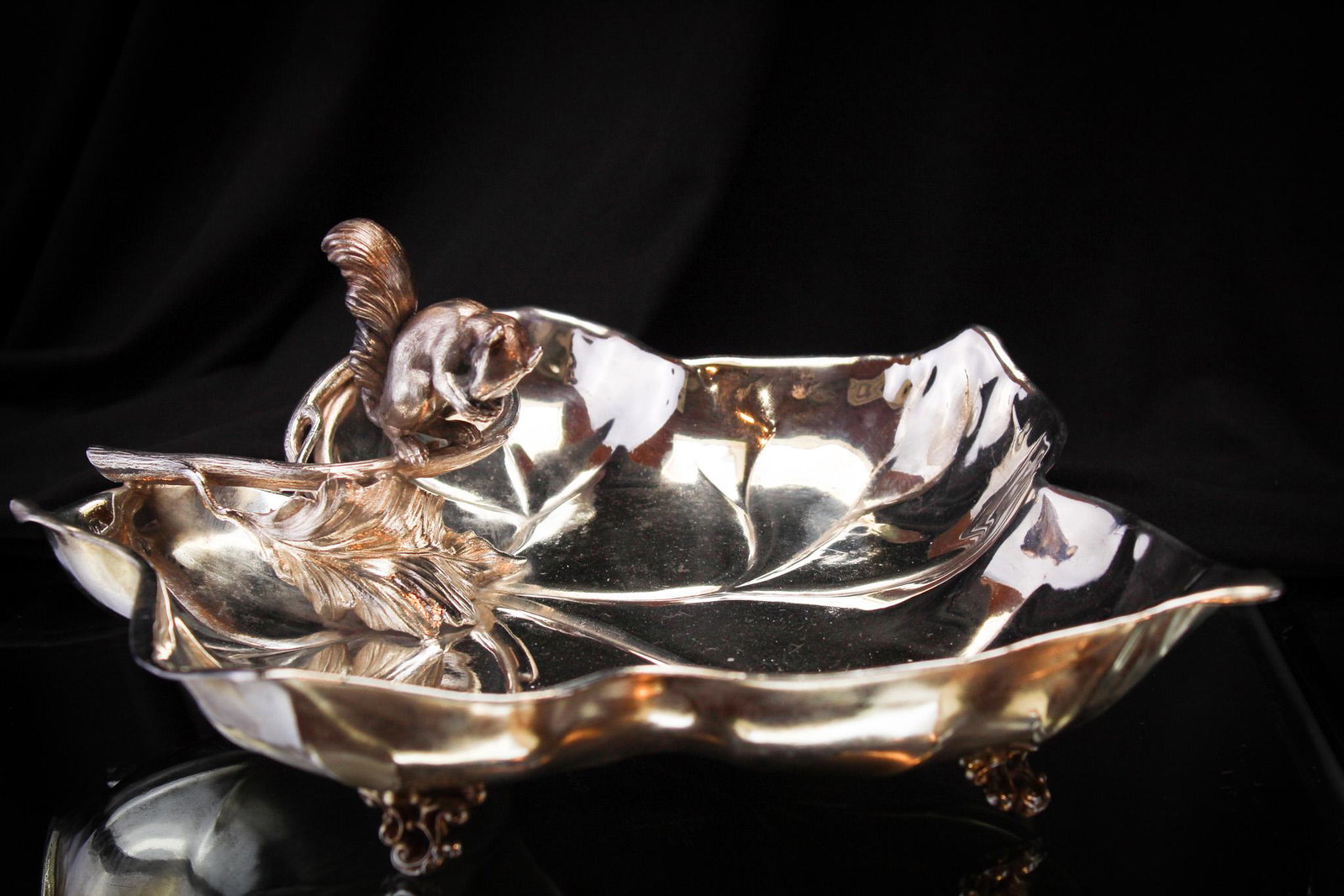 Triumph Victorian Silverplate Figural Ivy Nut Bowl: Amazing figural Victorian nut bowl featuring a squirrel perched above an english ivy leaf bowl. It measures 3 1/2" by 10 1/2". Signed Triumph silverplate.
