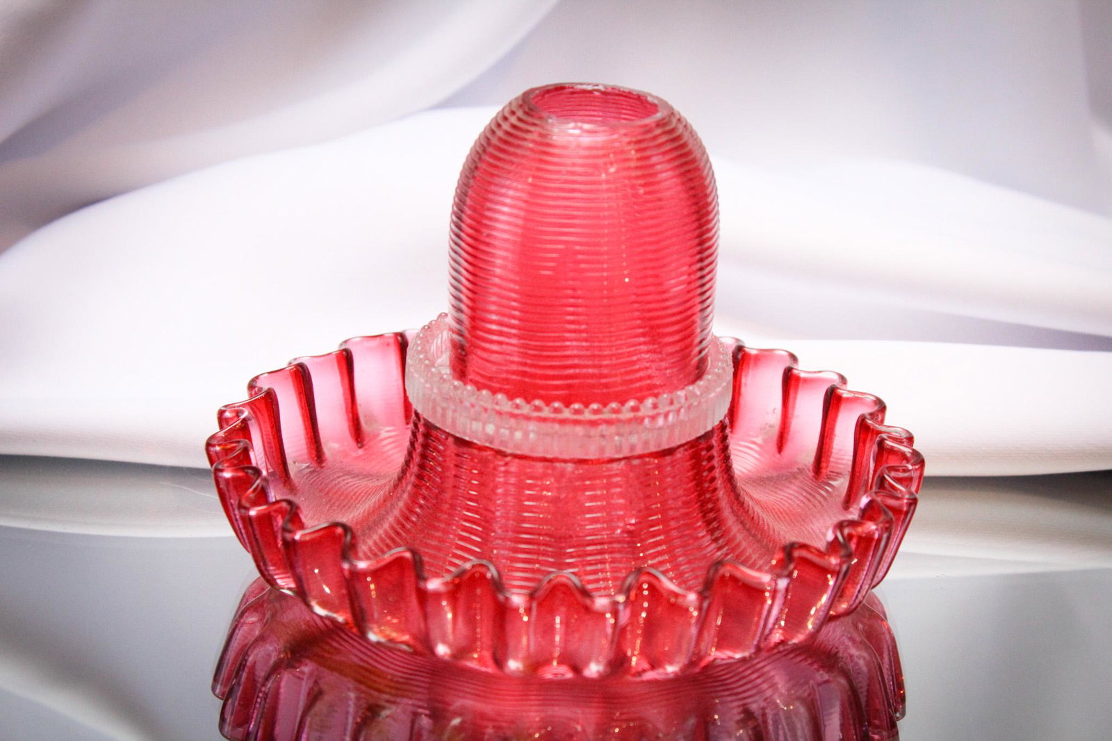 Cranberry Treaded Victorian Glass Fairy Lamp: Stunning original cranberry threaded fairy lamp complete with matching base and Clarke's insert. Fine piece for any collection. It stands 4 1/4" tall.