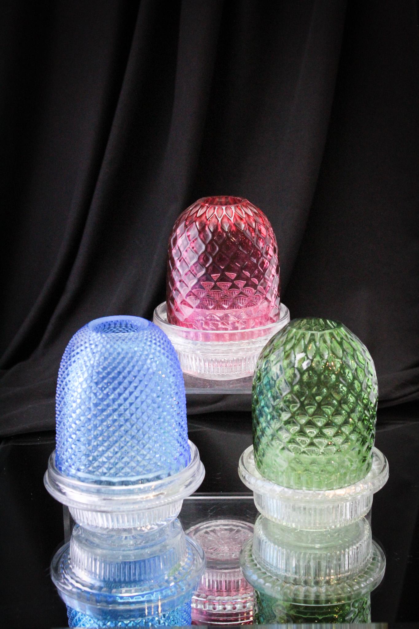 3 pc Lot Victorian Fairy Lamps: Sensational grouping of three fairy lamps in cranberry, blue, and green. All with Clarke's signed bases and two Clarke's candle cups. Tallest measures 5".