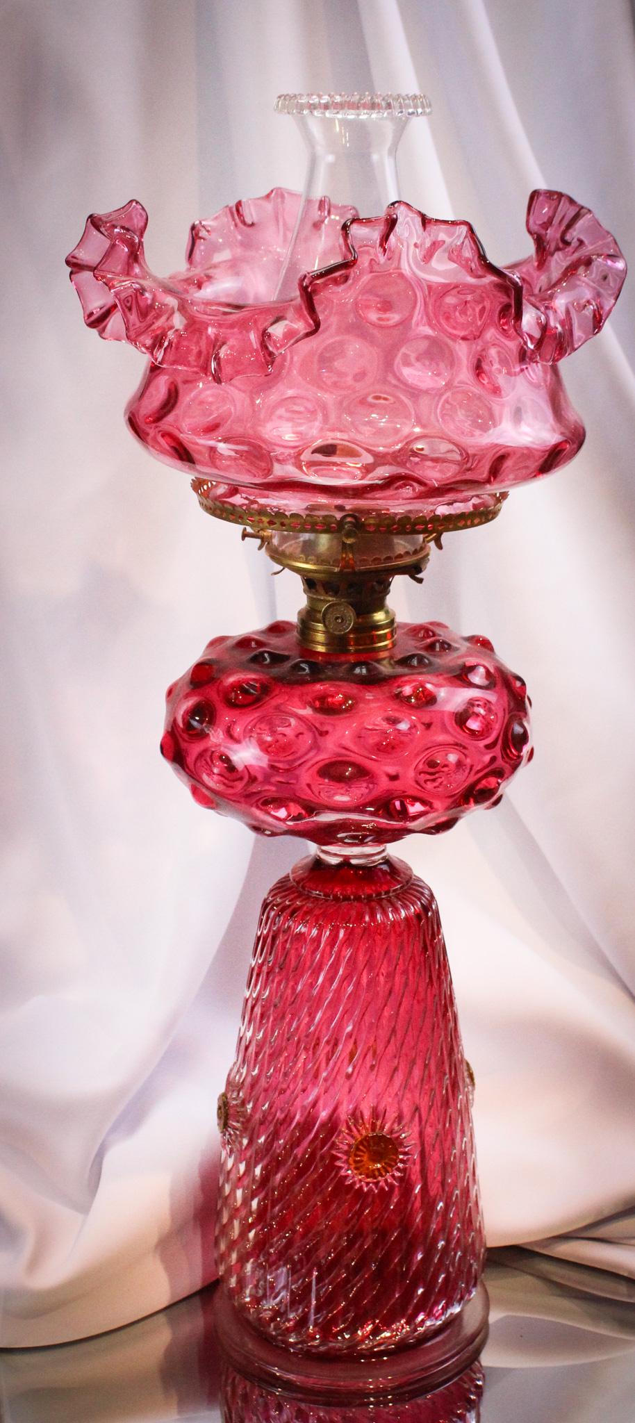 Rare Victorian Cranberry Rare Form Banquet Parlor Oil Lamp: How many of these have you seen? Stunning cranberry Victorian three tier banquet oil lamp with very unusual form base and attached glass font. Killer example. It stands 21" tall.