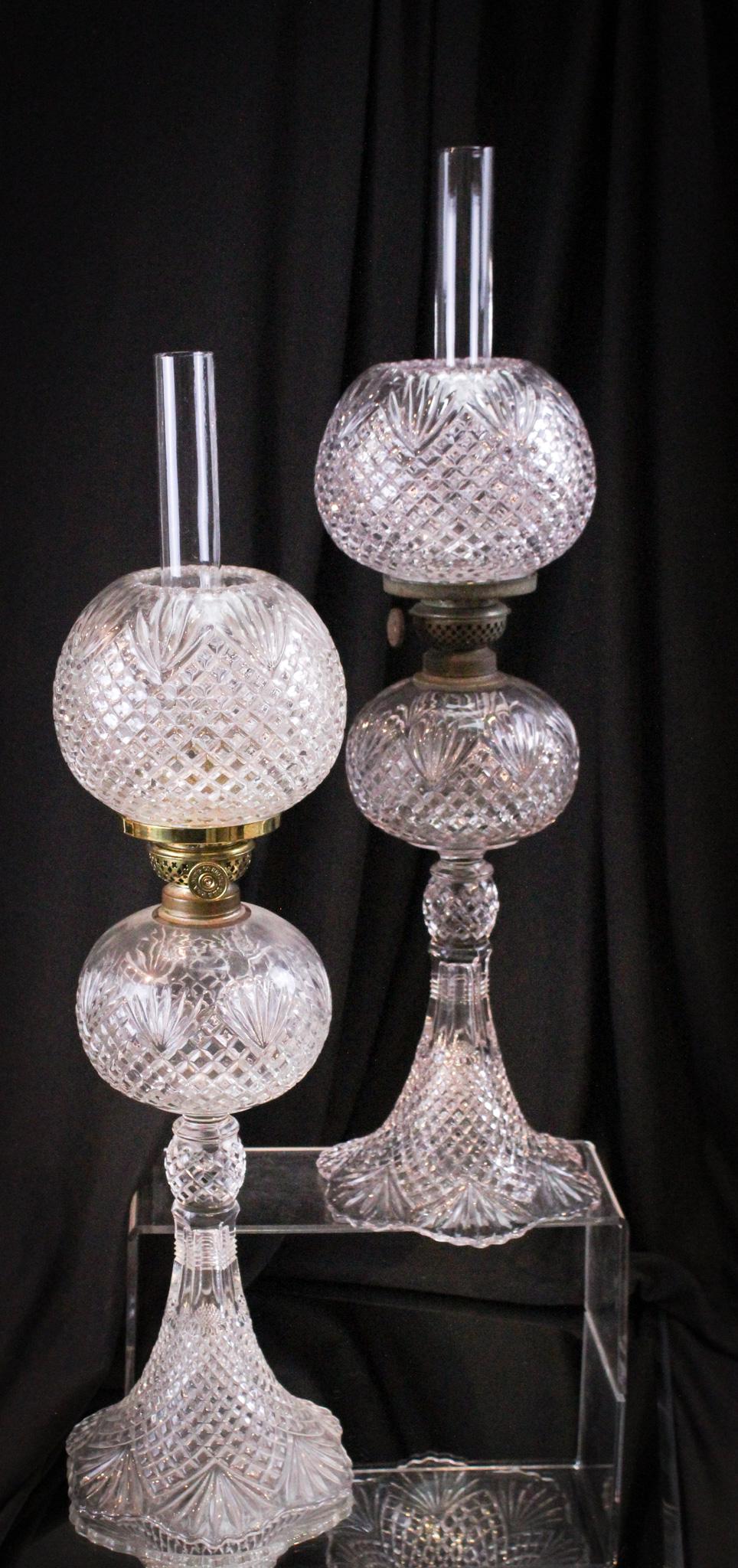 Pair Victorian Strawberry & Fan Junior Oil Lamps: Select offering of a matched pair of Victorian Strawberry and Fan pattern junior banquet oil lamps. Complete with matching original chimneys and shades. Each measures 17" tall.