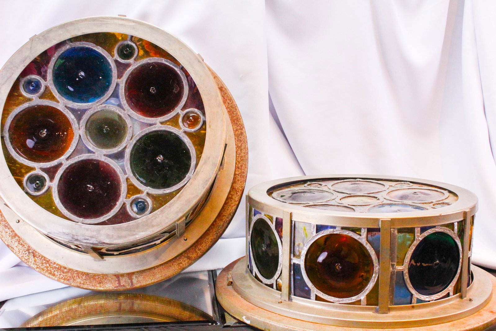 Architectural Salvage Odd Fellow's Lodge leaded Stained Glass Lights: Great pair of architectural salvage from an old Odd Fellow's Lodge stained leaded glass ceiling fixture lamps. Lamps are in array of colors. As found. Each measures 18" diameter, 7" tall.