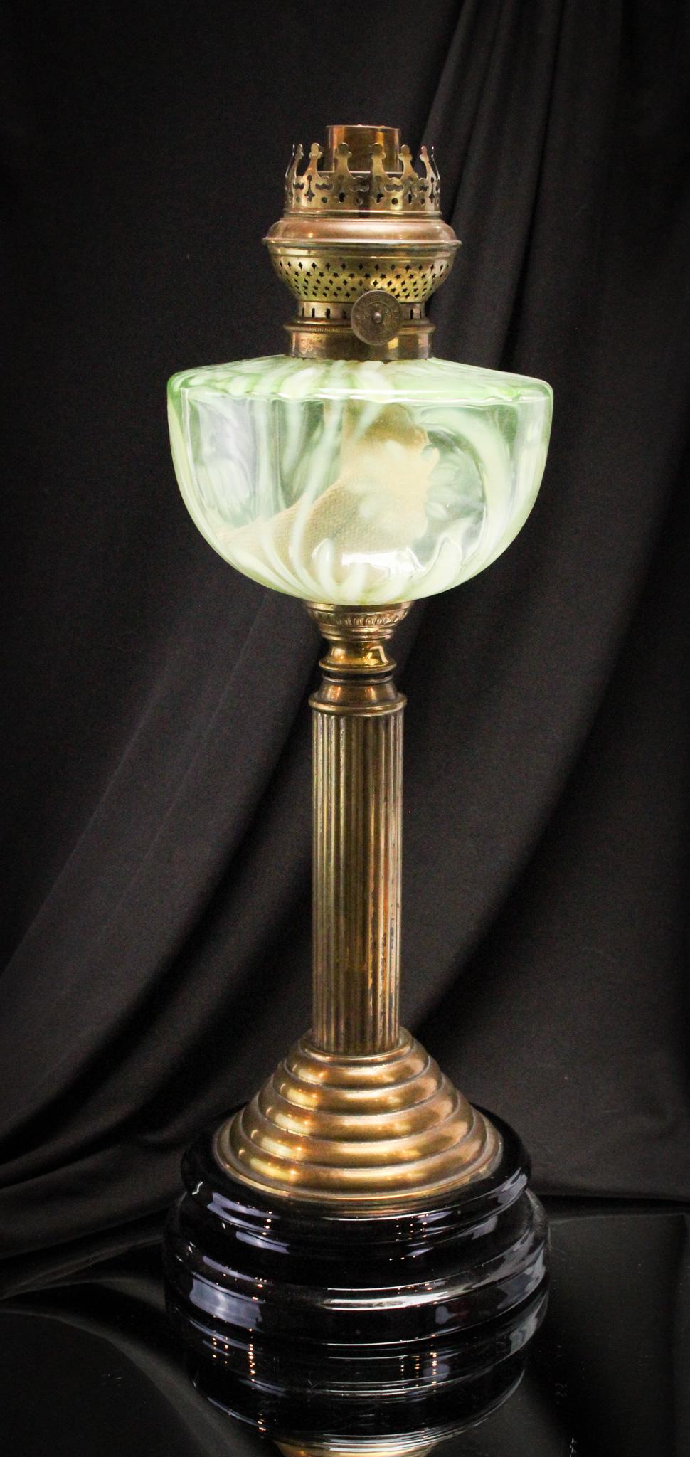 English Victorian Vaseline Opalescent Glass Oil Banquet Lamp: Great and showy example of an English vaseline opalescent standard banquet oil lamp. Lamp font is decorated with all over daisy and foliage opal decoration. It stands 19" tall.