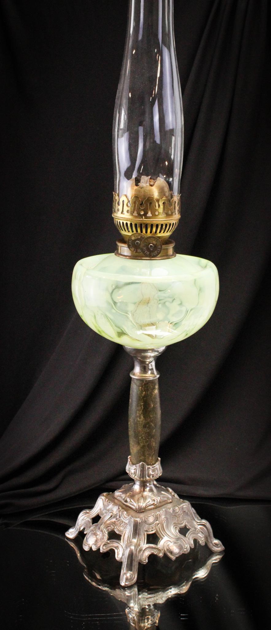 Vaseline Opalescent Crocus Victorian Oil Lamp: What an eye-catching beauty this charmer is. Great coloring to the vaseline glass and dreamy opalescence to the crocus pattern. Oil lamp measures 15" tall.