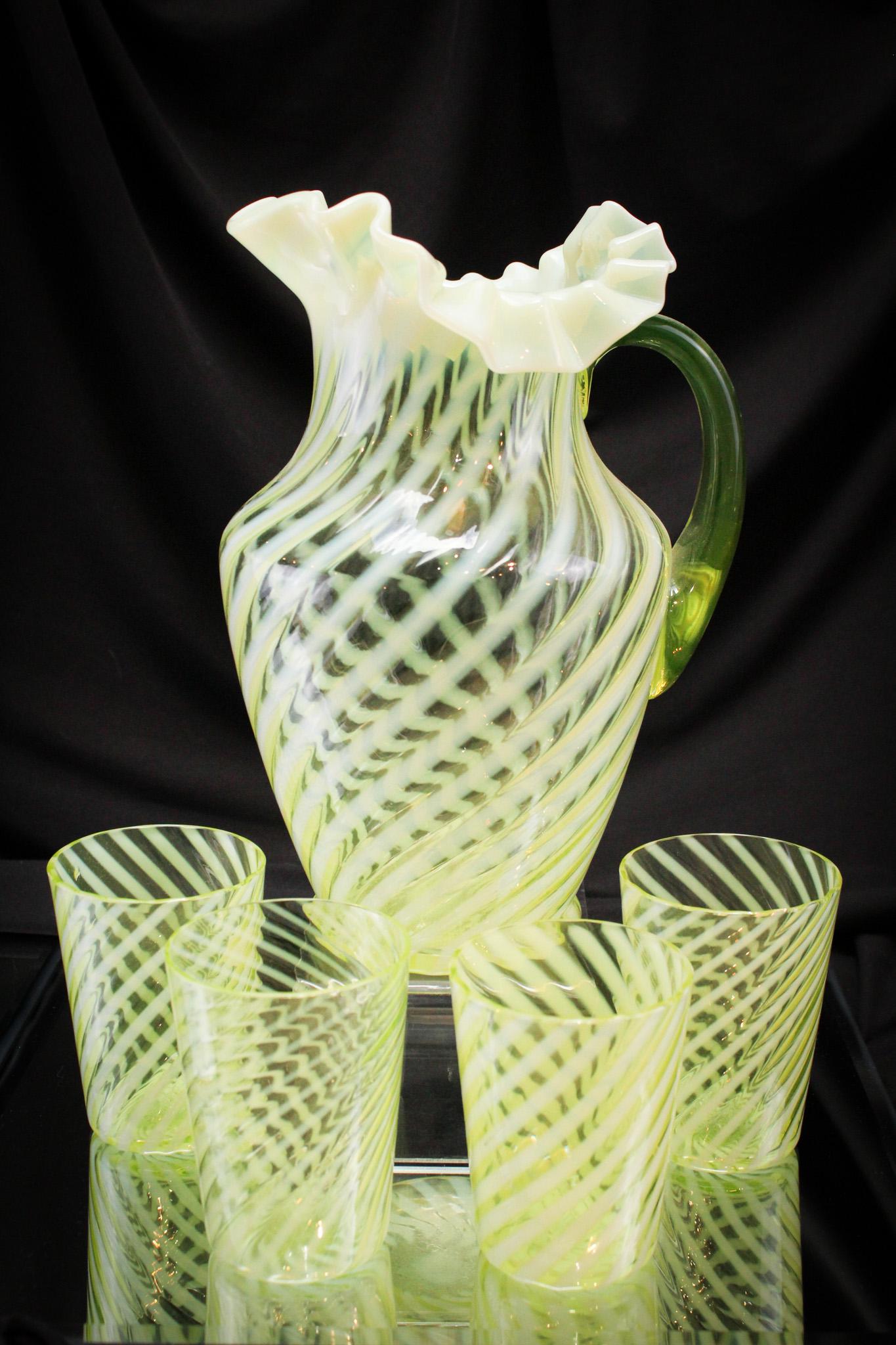 Rare Northwood Vaseline Opalescent Swirl Water Set: Striking Northwood vaseline opalescent water set. Phenomenal set with the best lemon yellow vaseline coloring and brilliant opalescence. Set is comprised of pitcher and four tumblers. Tallest measures