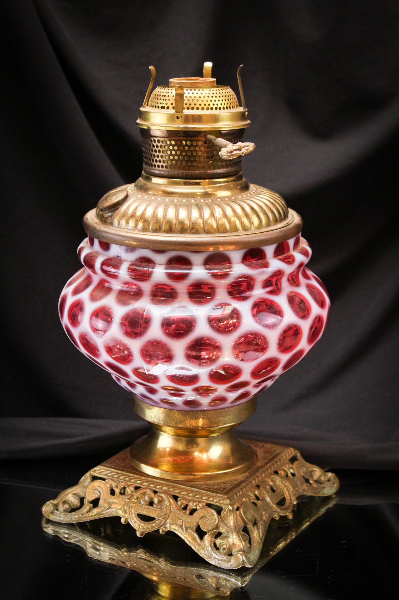 Rare Cranberry Opalescent Big Windows Oil Lamp: Beautiful Cranberry opalescent Big Windows pattern Victorian oil lamp base. Base has been electrified. Excellent coloring. It measures 12" tall.