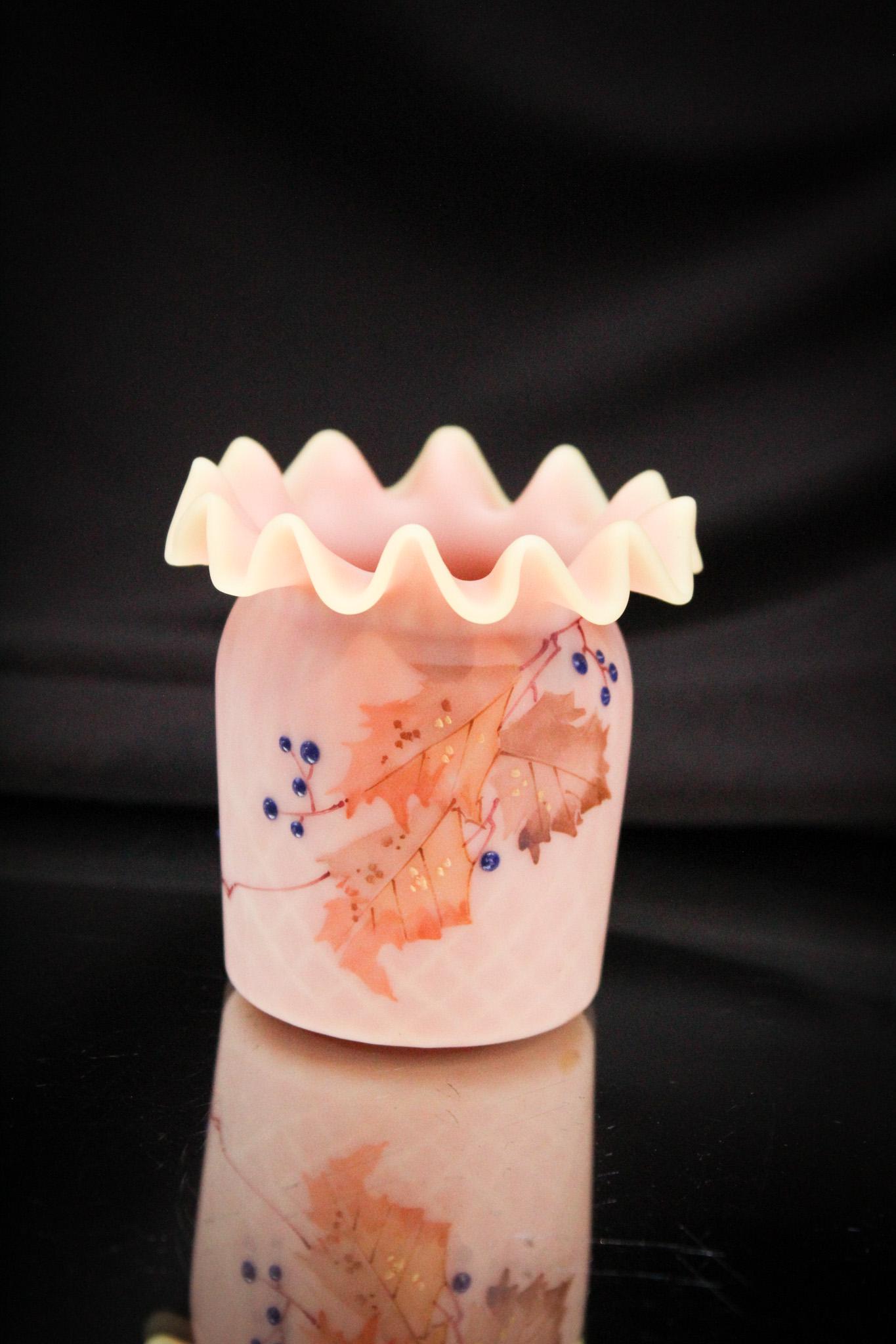 Mt. Washington Burmese DQ Blue Berry & Leaf Victorian Toothpick Holder: Wonderful blue berry and leaf decoration accents this fine burmese toothpick holder with diamond quilting and ruffled rim. Fine piece measuring 2 1/2" tall.