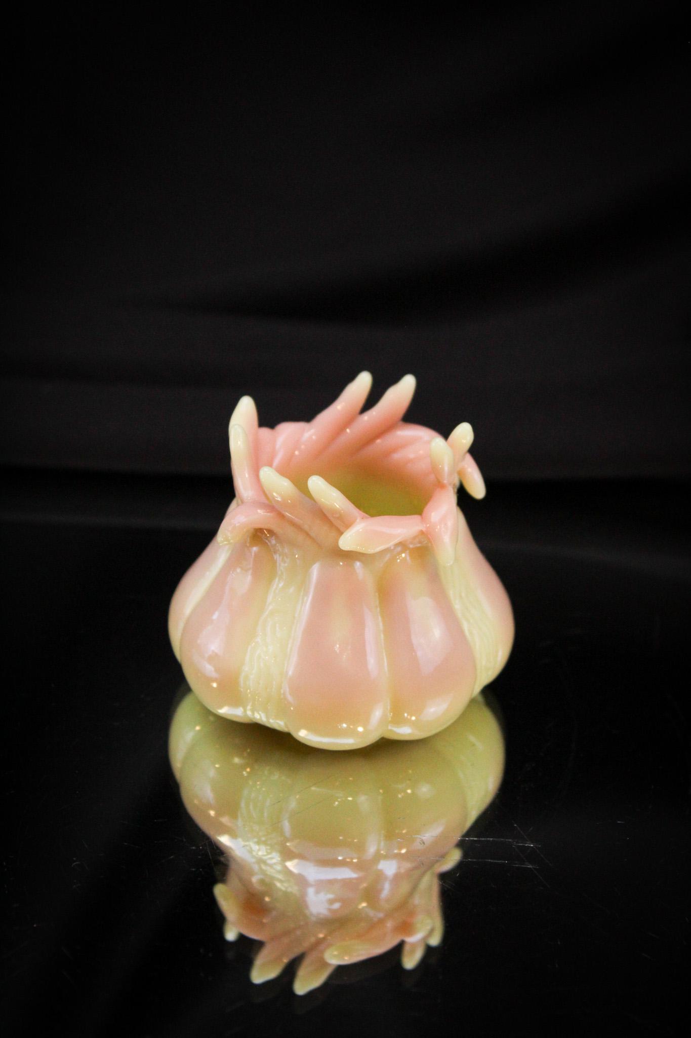 Mt. Washington Glossy Burmese Fingers Fig Mold Toothpick Holder: A true scarcity. Lovely Mt. Washington glossy burmese fig mold Victorian toothpick holder with cut fingered top. Alas, one finger has been lost. Fantastically beautiful example. It stands 2 1/4" tall.