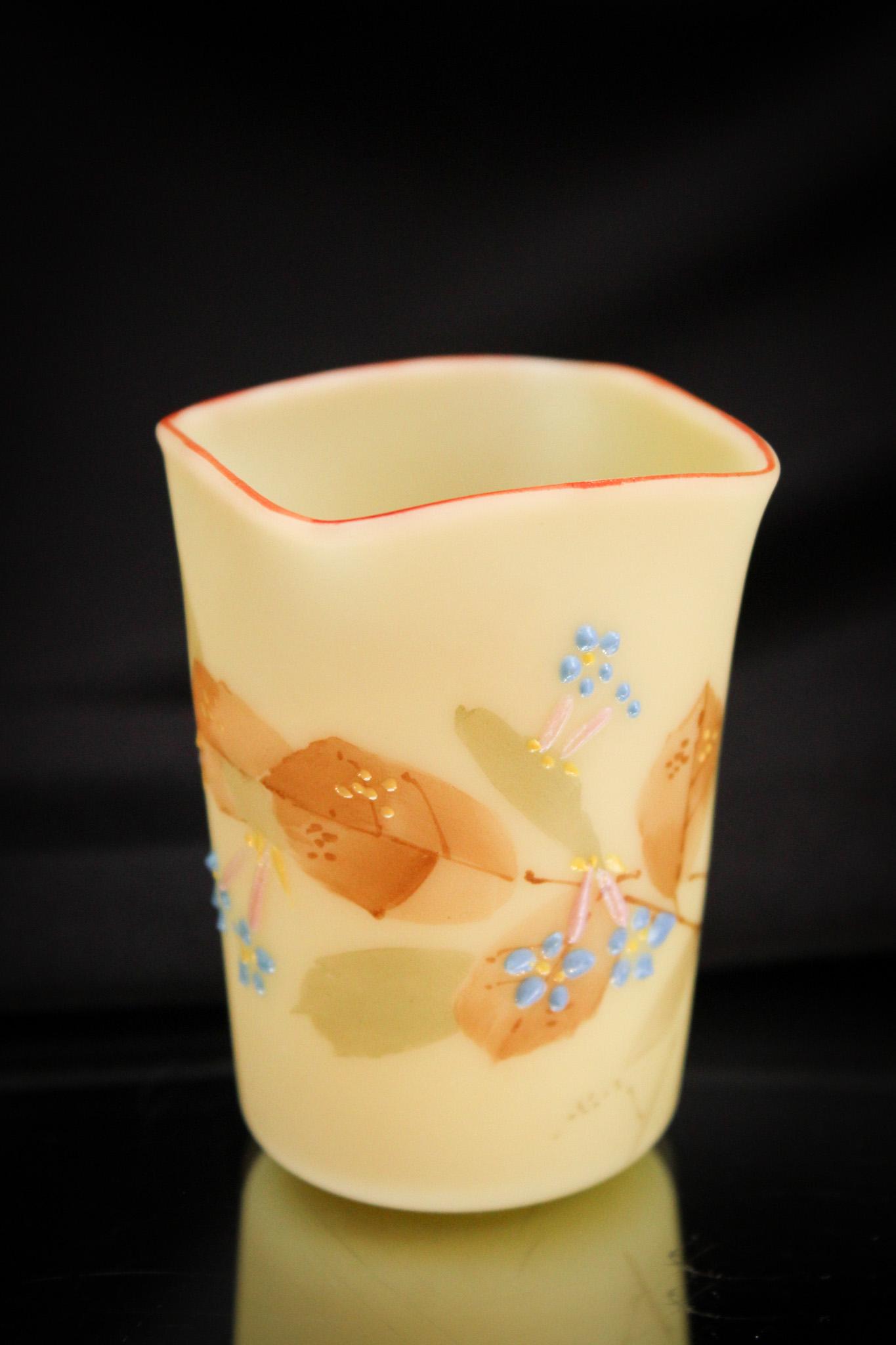 Mt. Washington Unfired Burmese Victorian Toothpick Holder: Fine offering of another unfired burmese Victorian toothpick holder. This one showcases red enameled rim and florals abound. It stands 2 3/4" tall.