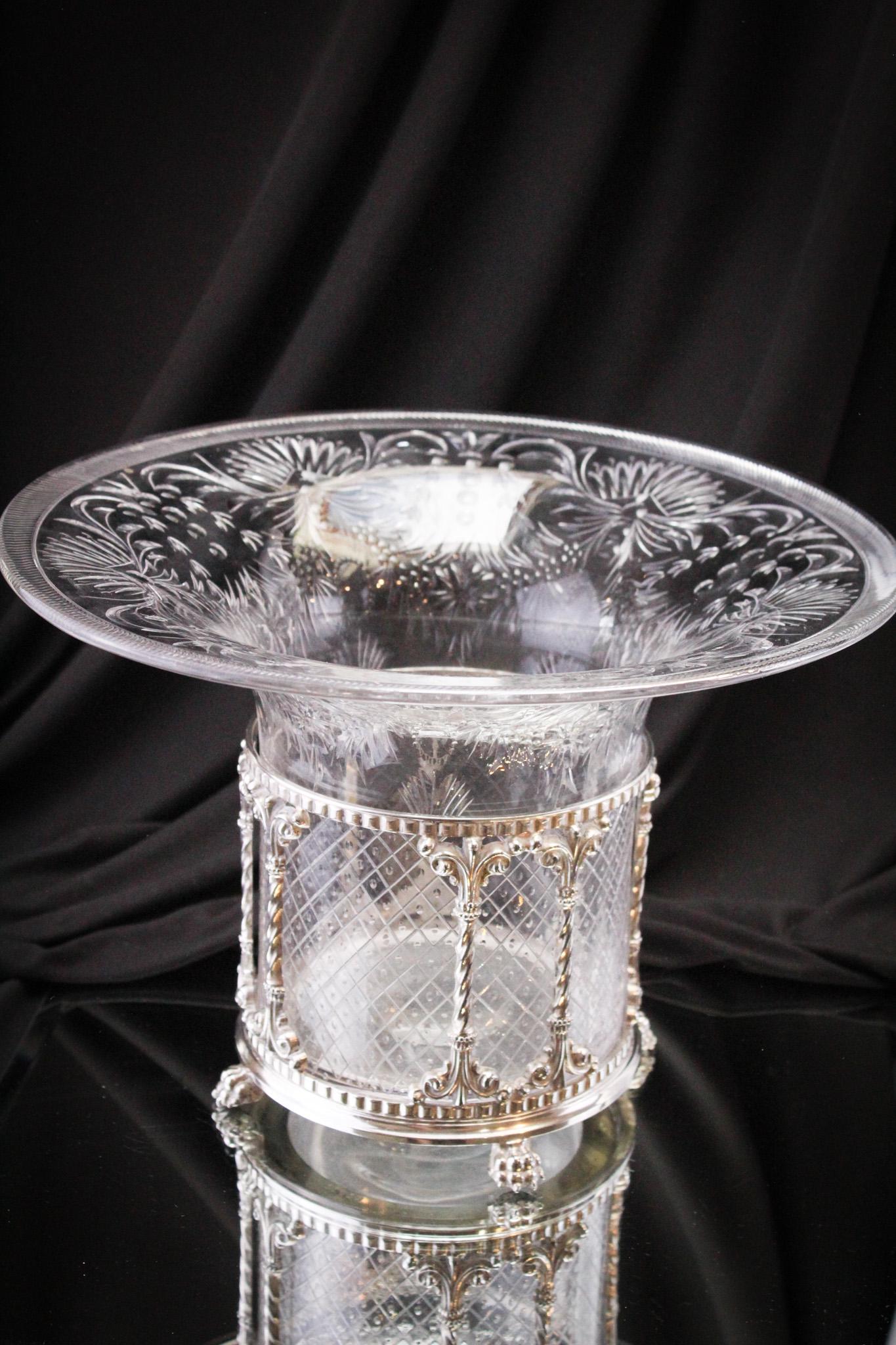 Large 12" Pairpoint Silverplate Cut Glass Centerpiece: Oh folks, this one is nice! Beautifully made and masterfully cut Pairpoint bowl and original silverplate holder specific for it. Piece measures 8" tall, 11 1/2" diameter. Beautiful.