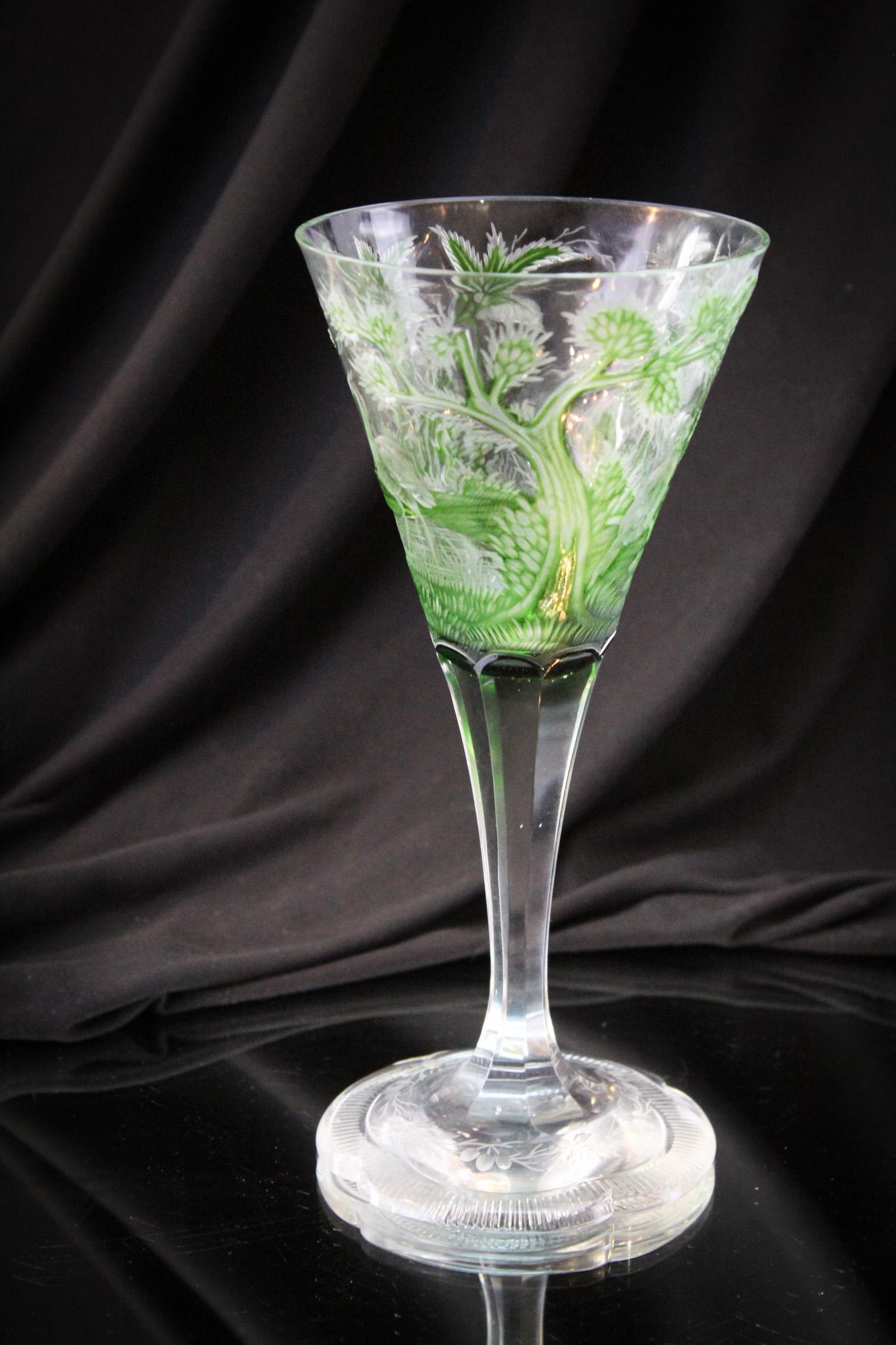 Moser Bohemain Intaglio Engraved 8 1/4" Goblet: Fanciful forest green intaglio engraved cut 8 1/4" tall goblet. Piece is masterfully made and highly detailed with woodland scene with cranes amongst the foliage. Attributed to Moser or other Bohemian