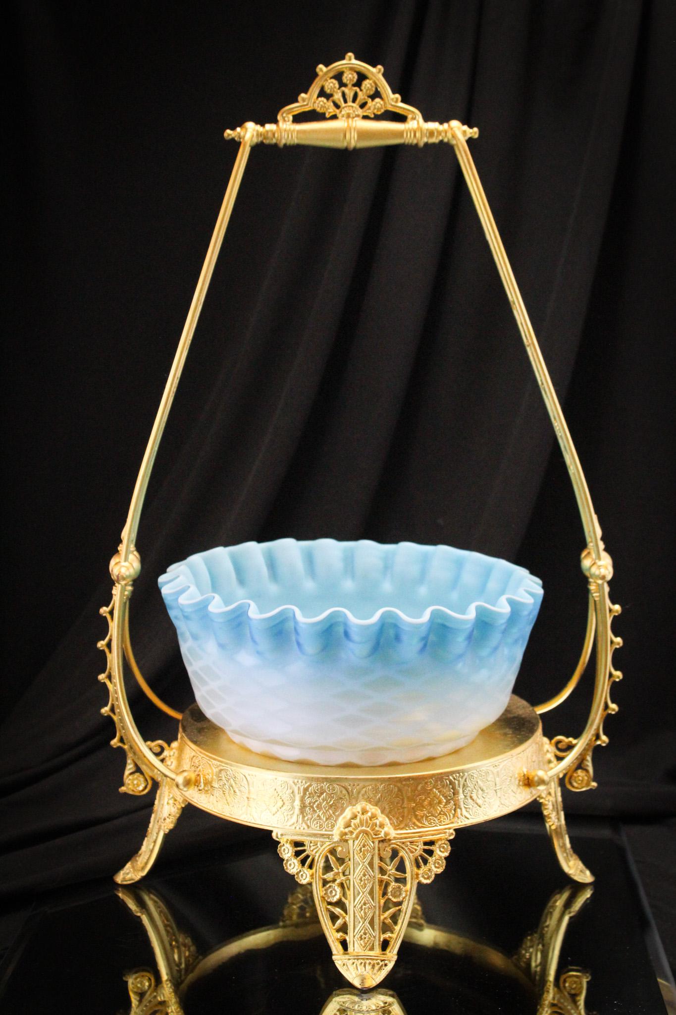 Tufts Gold Leafed Victorian Silverplate Blue Satin Glass Brides Basket: Brides basket is signed gold leafed silverplate James Tufts. Basket comes along with asociated blue mother of pearl Victorian satin diamond quilt brides bowl. Fine examples of each. Shown together. Co